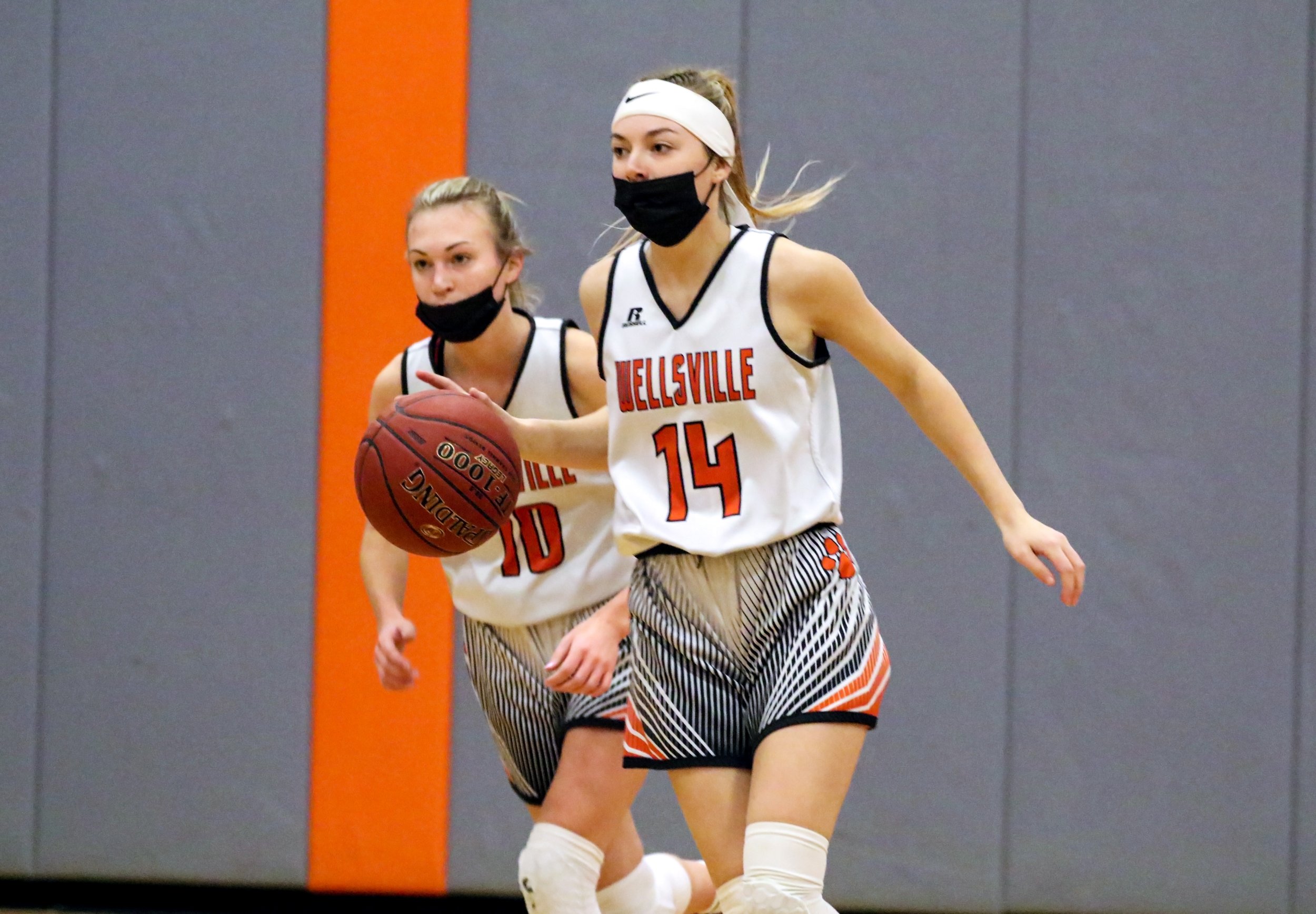  Wellsville freshman Natalie Adams (14) pushes the pace down court with senior Marley Adams (10) racing back during Saturday night’s home contest against Letchworth. [Chris Brooks/WellsvilleSports.com] 