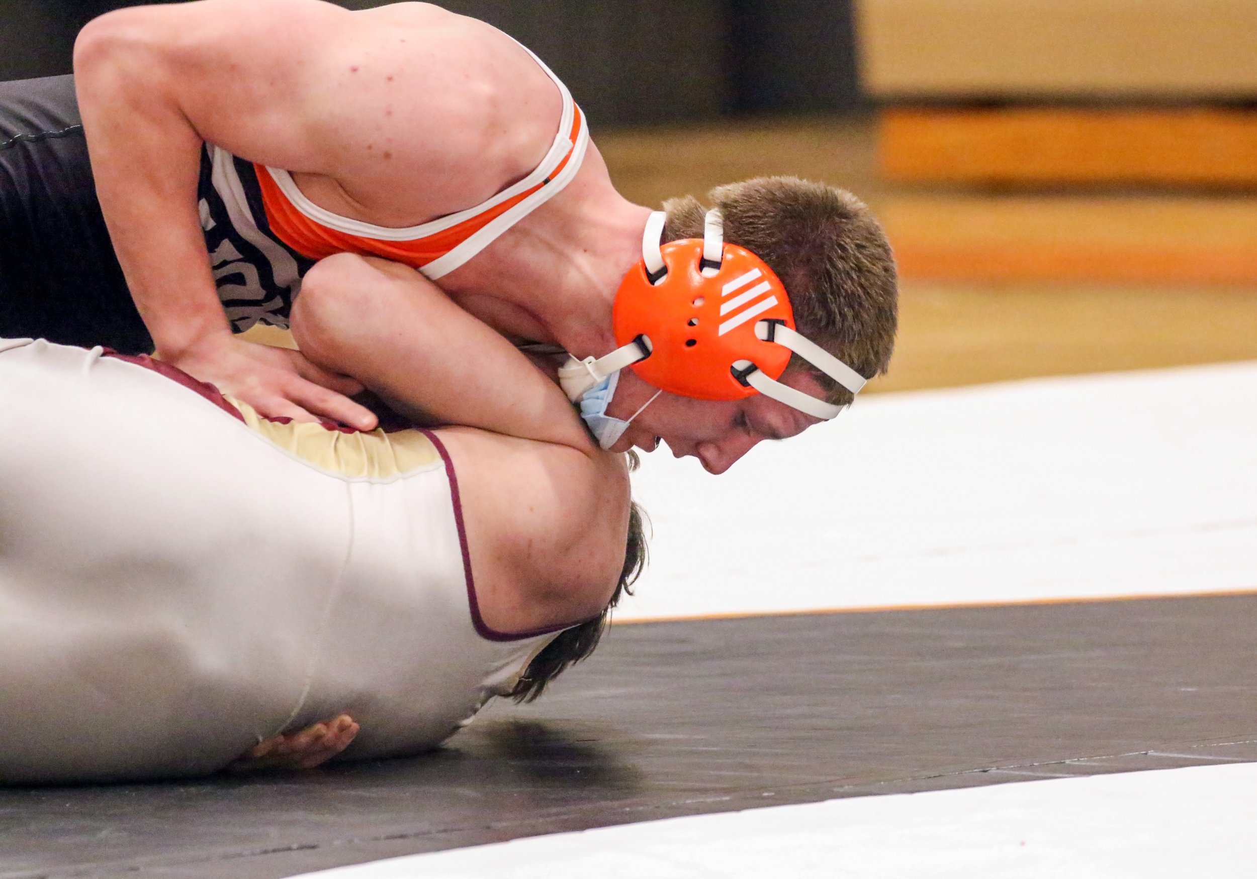  Wellsville’s Xander Outman, top, looks to roll over his opponent for the pin during his bout at 152 pounds in Tuesday night’s home match against Avoca/Prattsburgh/Hammondsport. [Chris Brooks/WellsvilleSports.com] 