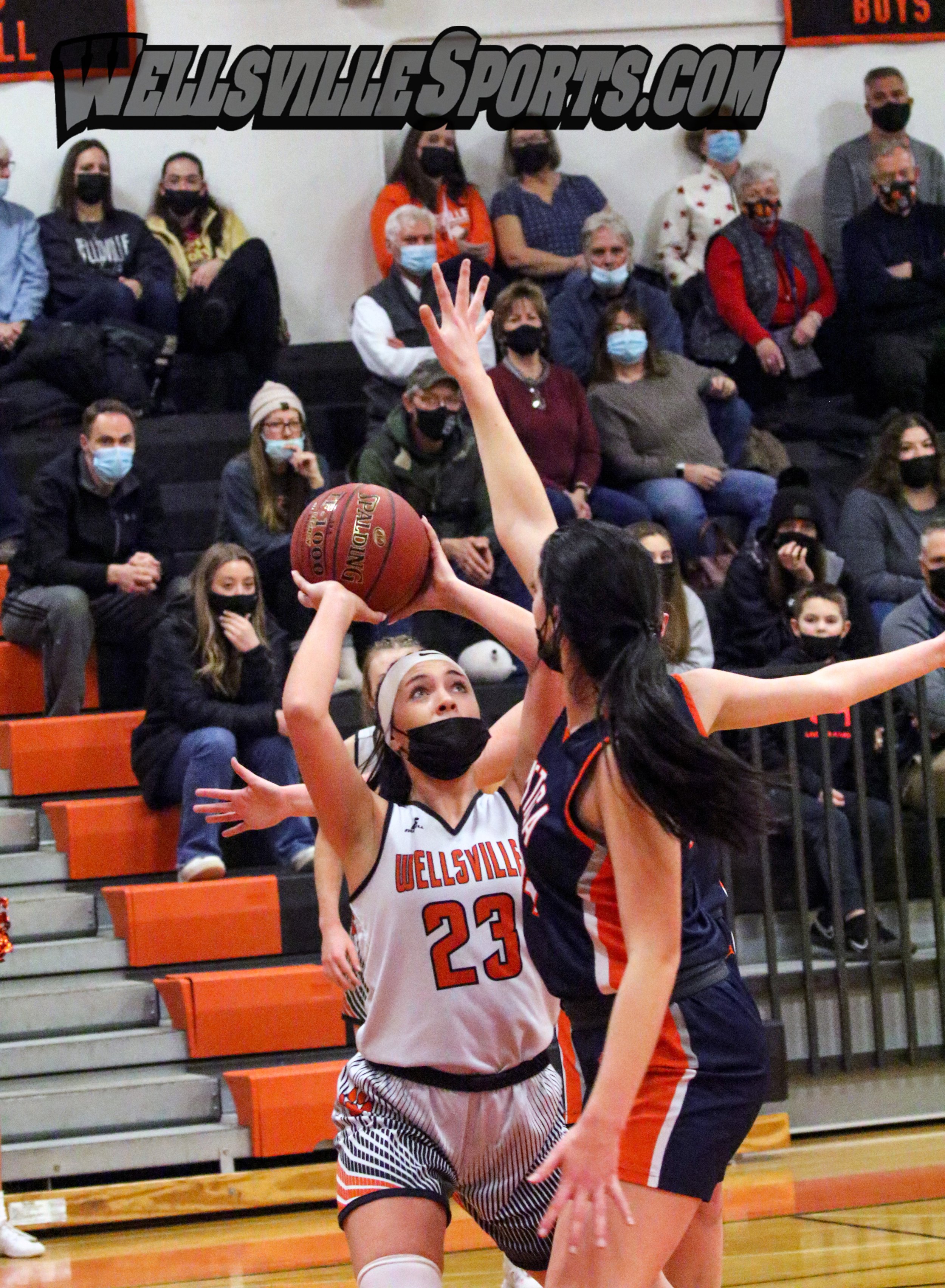  Wellsville senior Kaylee Coleman (23) looks to put up a shot inside the paint against the Attica defense during Friday night’s Class B2 Quarterfinal matchup in Wellsville. 
