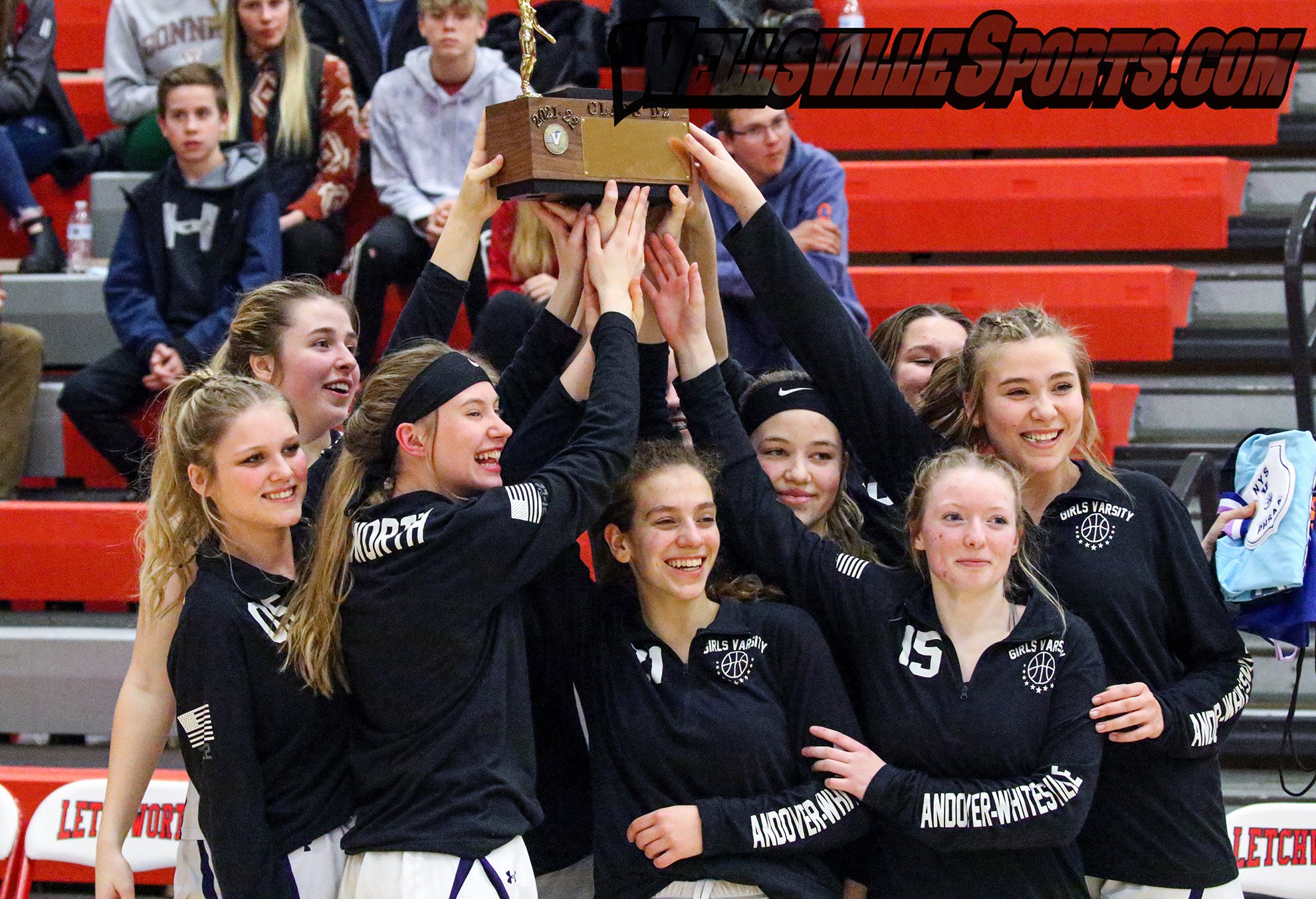  Andover/Whitesville holds up their newest prize to the trophy showcase, as they collect their first Class  D2 Championship in their debut season together after a 49-43 win over Avoca/Prattsburgh in the Finals on Friday at Letchworth. Andover/Whitesv