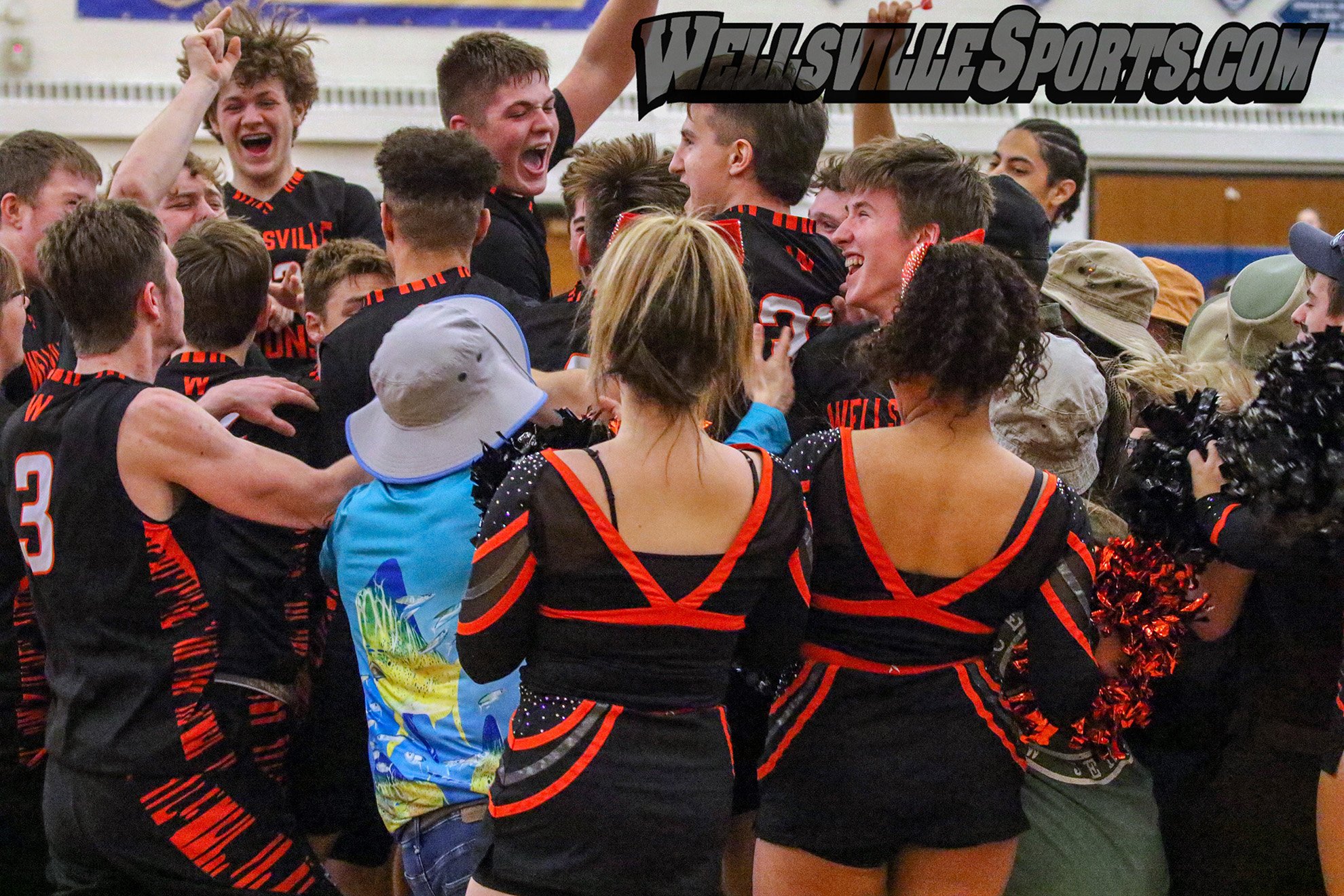  The Wellsville Lions come together to celebrate after the buzzer rang out on their 66-58 victory over the Mynderse Blue Devils to capture their third Class B2 Championship in seven years at Webster Schroeder on Saturday. The Lions will now face Clas