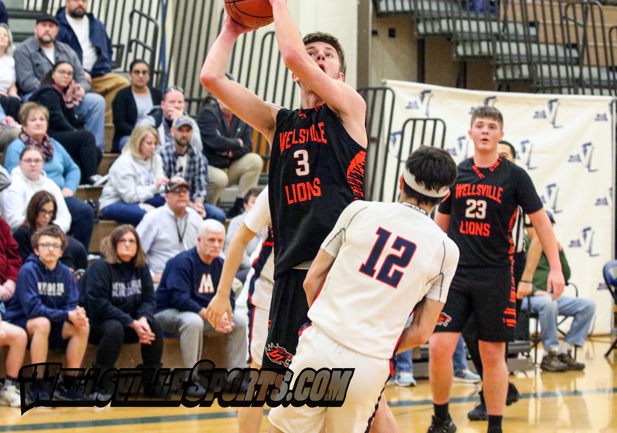  Wellsville senior Alex Perkins (3) goes up for the basket up against the Mynderse defense during Saturday afternoon’s Class B2 Finals in Webster. [Chris Brooks/WellsvilleSports.com] 