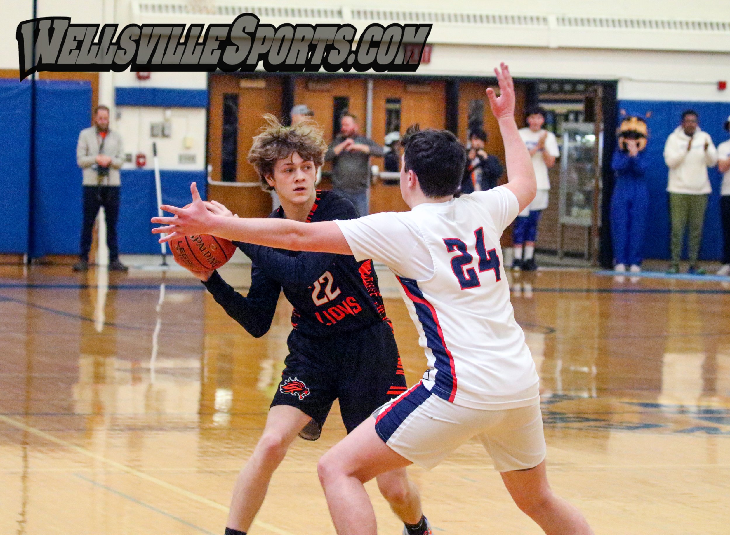  Wellsville junior Aidan Riley (22) looks to provide a pass to the inside while being pressured by the Mynderse defense during Saturday afternoon’s Class B2 Finals in Webster. [Chris Brooks/WellsvilleSports.com] 