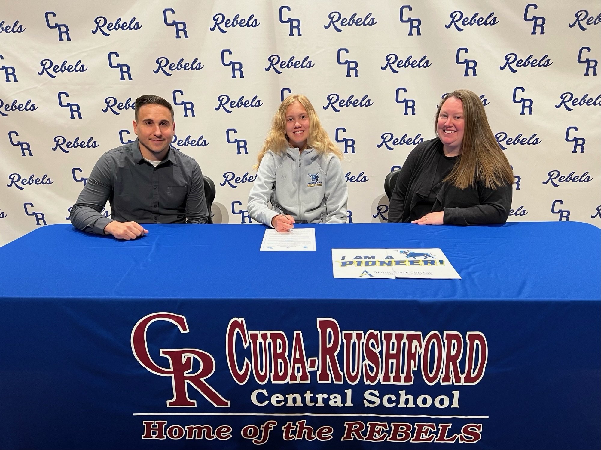  Cuba-Rushford senior Taylor Searle, middle, officially signed the dotted line to continue furthering her education, as well as her athletic careers in soccer and basketball, in the local area, at Alfred State College beginning this Fall. She is join
