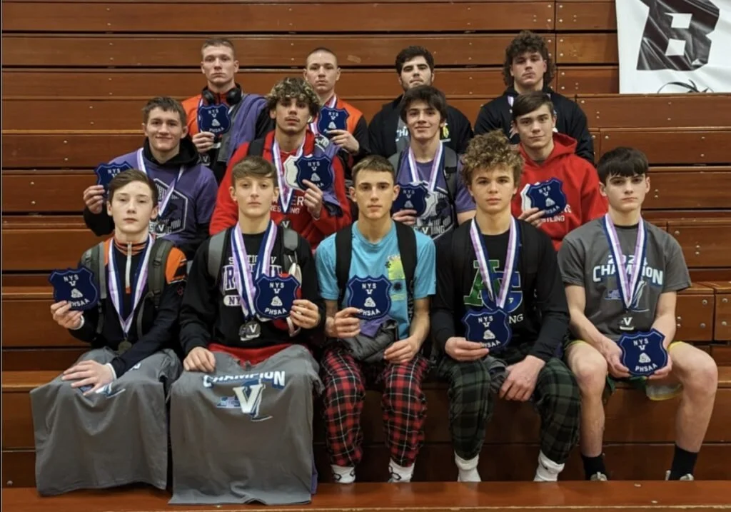 Wellsville wrestling defies incredible odds, celebrates Section V Champions in Outman, Black in style with welcome back home at Snowball Dance; Both Lions advance to State Qualifiers
