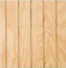 Close-up of light-colored wooden planks arranged vertically.