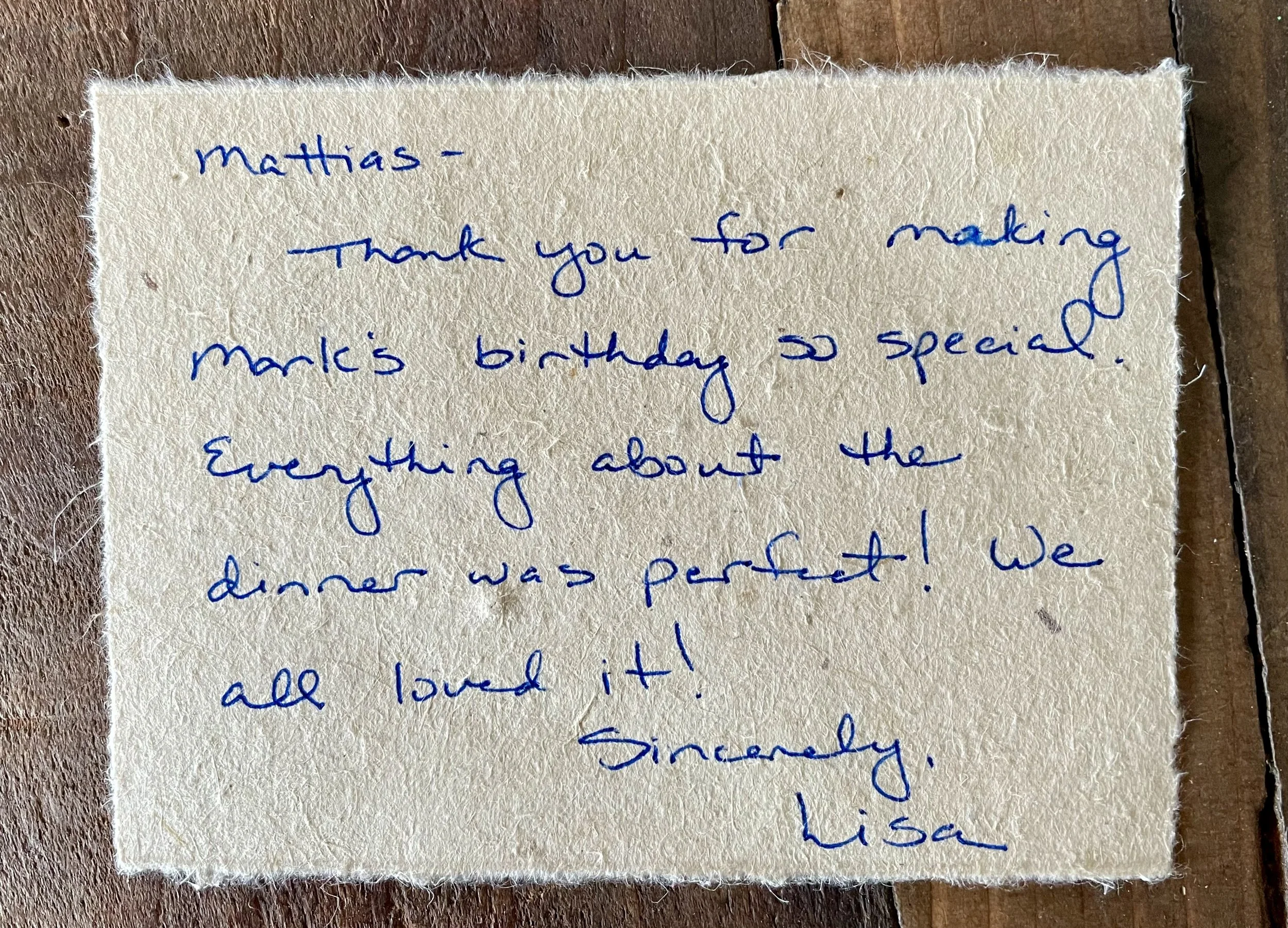 Handwritten note on textured paper with a message to Mattias, thanking him for making Mark's birthday special and praising the dinner.