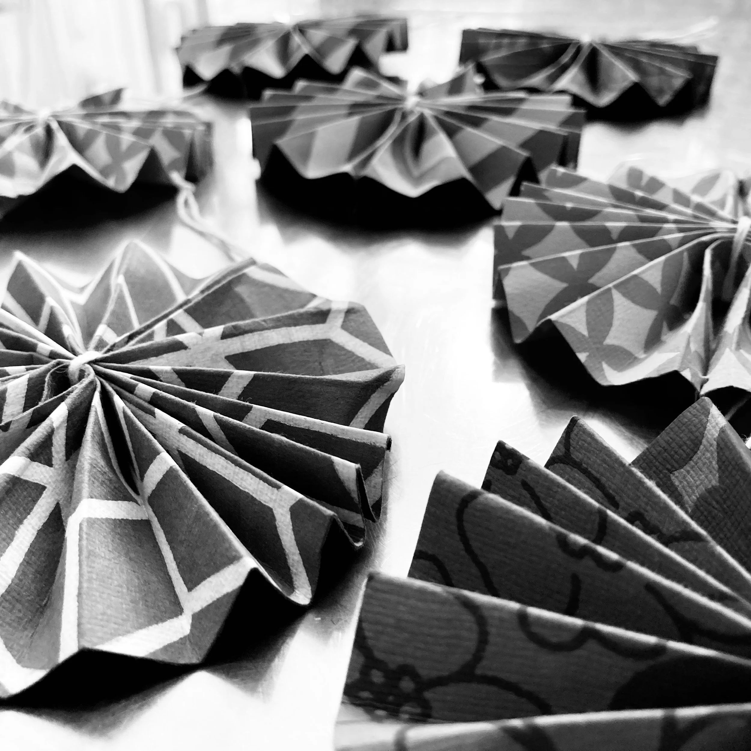 Circular folded Christmas paper decorations.
