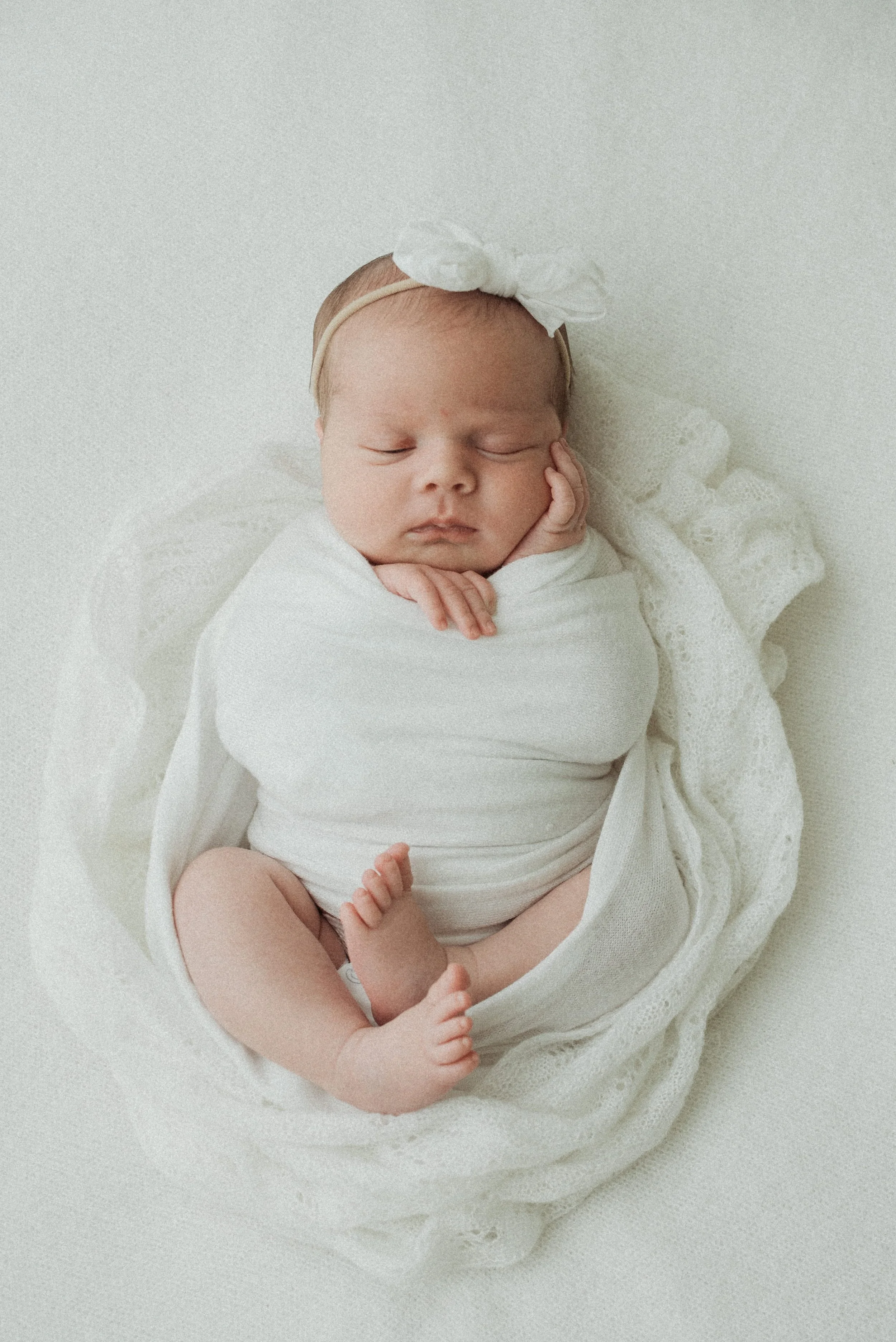 Baby wrapped and posed for a newborn session in Portland Maine