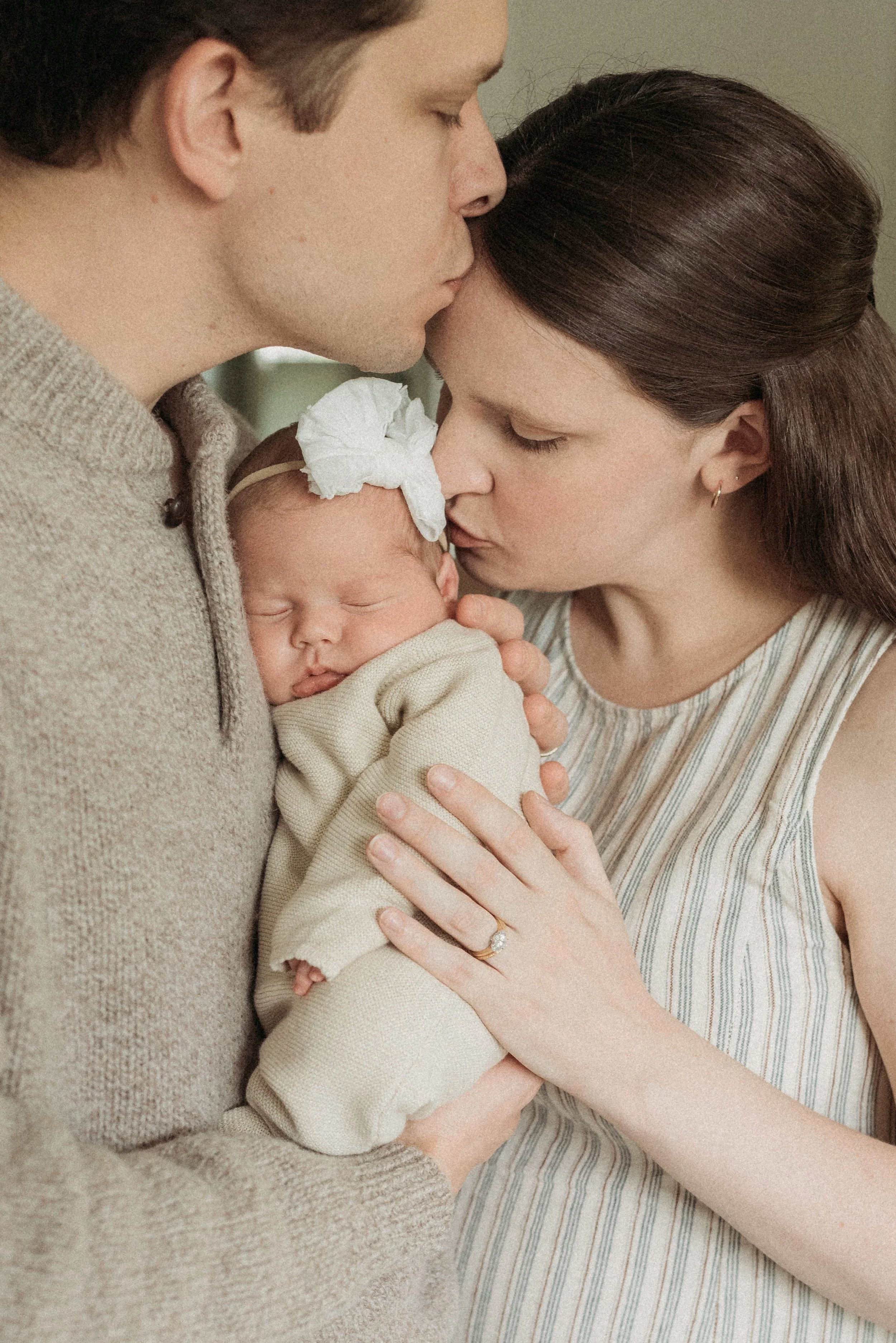 Mom Dad and baby during newborn session Portland Maine