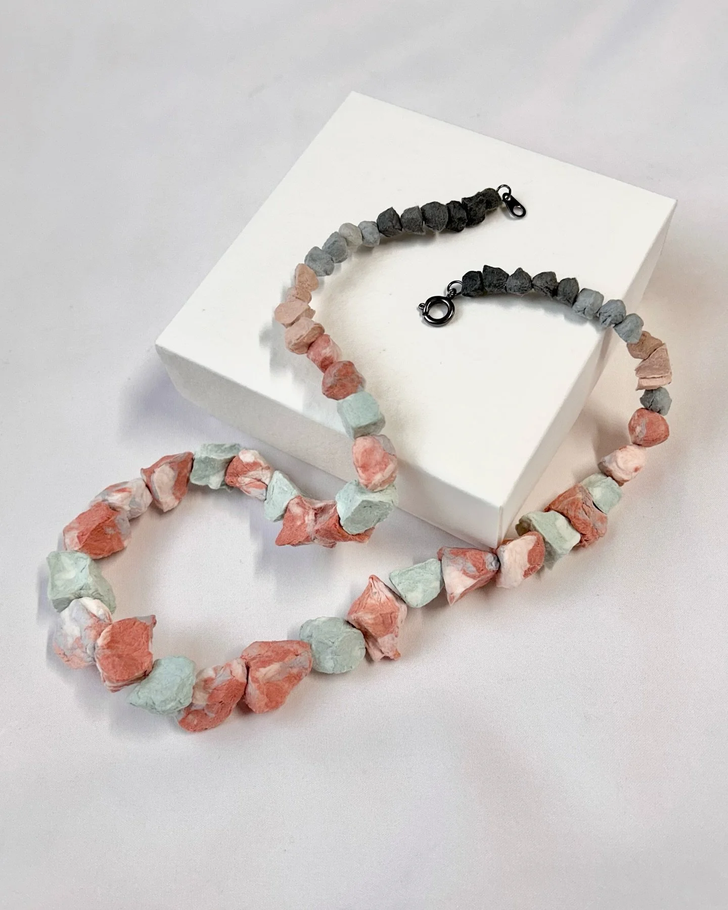 Over the years of making beads out of my leftover paper pulp from different batches of color, I now have a little rock collection. This was a fun one to put together, creating a desert palette with many different neutrals and earth tones, balancing o