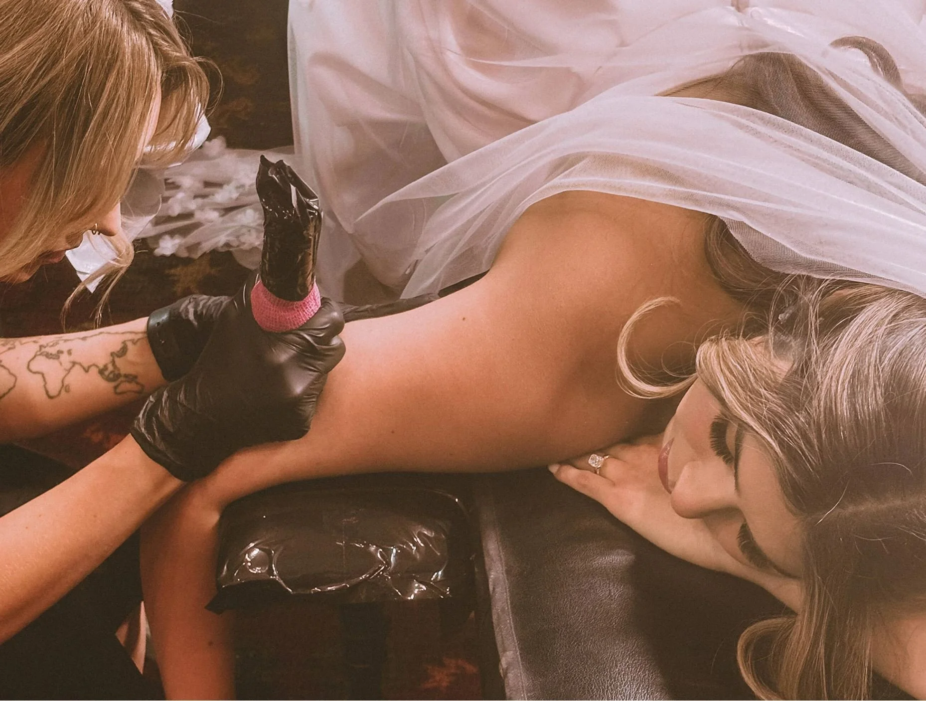 Giving a fine line tattoo at her Tucson wedding reception