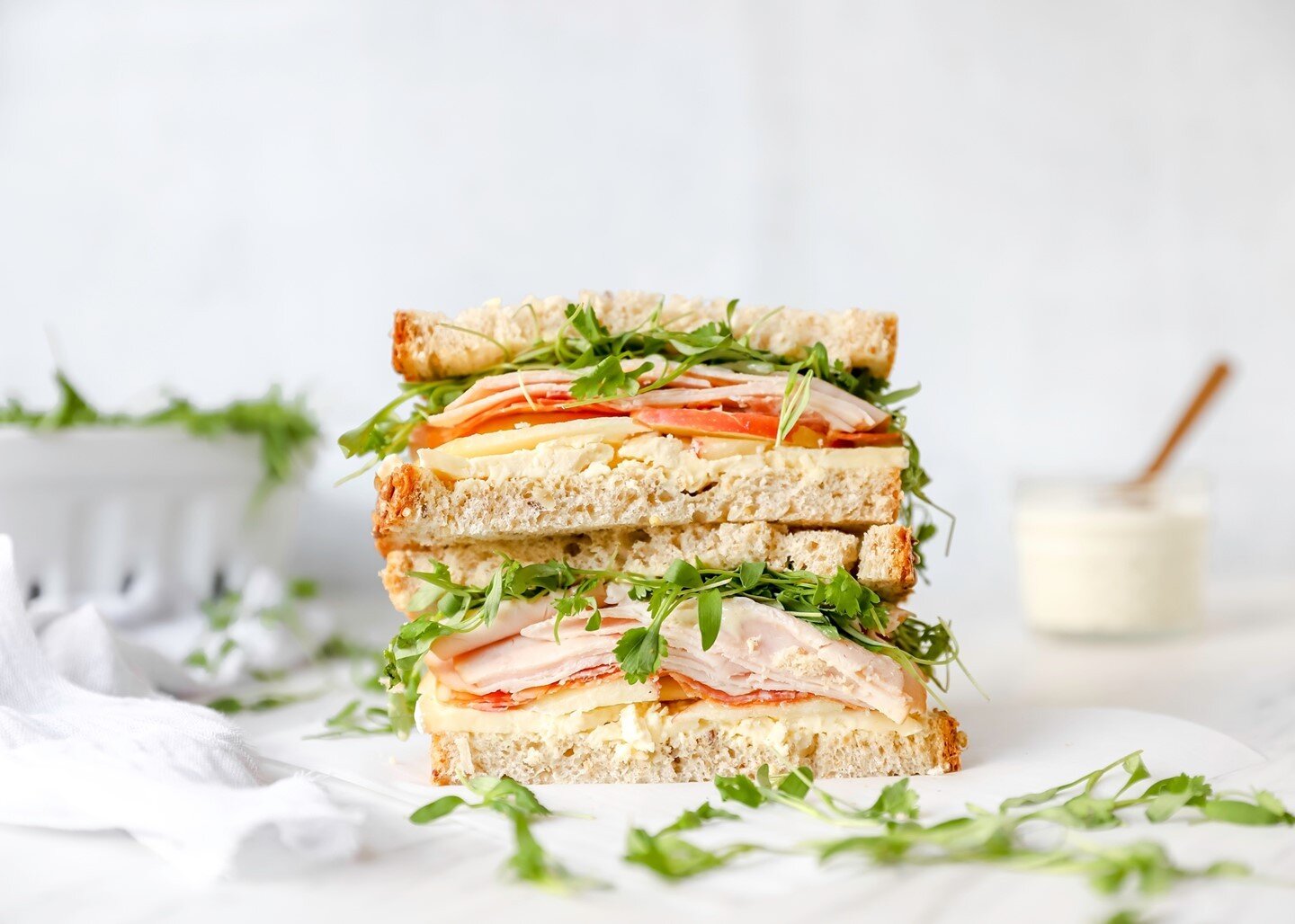 Who else is ready for the long weekend?! I'll be beaching it up this week and I'll be packing my beach sandwich along with all the things! This sandwich is so simple and so good! The triple cream and garlic honey spread make it extra special!  Here's