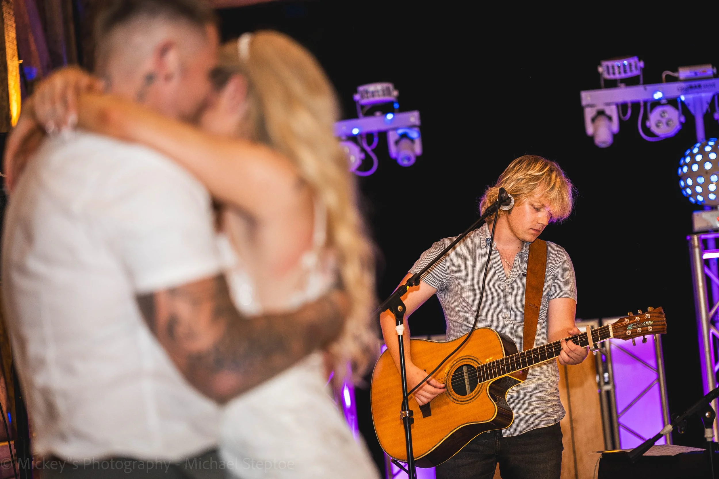 Country singer Luke Flear singing and playing guitar for the bride and grooms first dance!