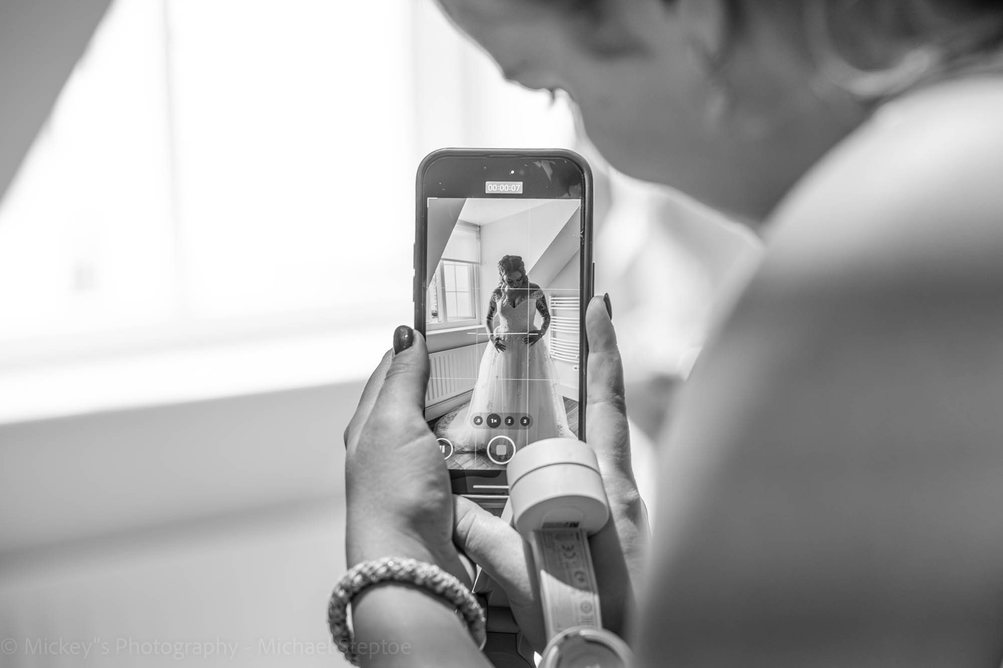 “Wedding content creator capturing behind the scenes moments at UK wedding”