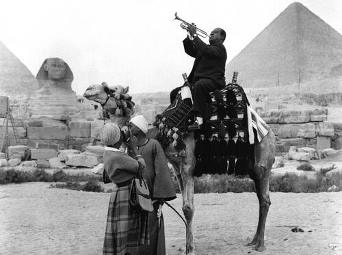 Louis-Armstrong-on-camel-at-the-pyramids.jpg