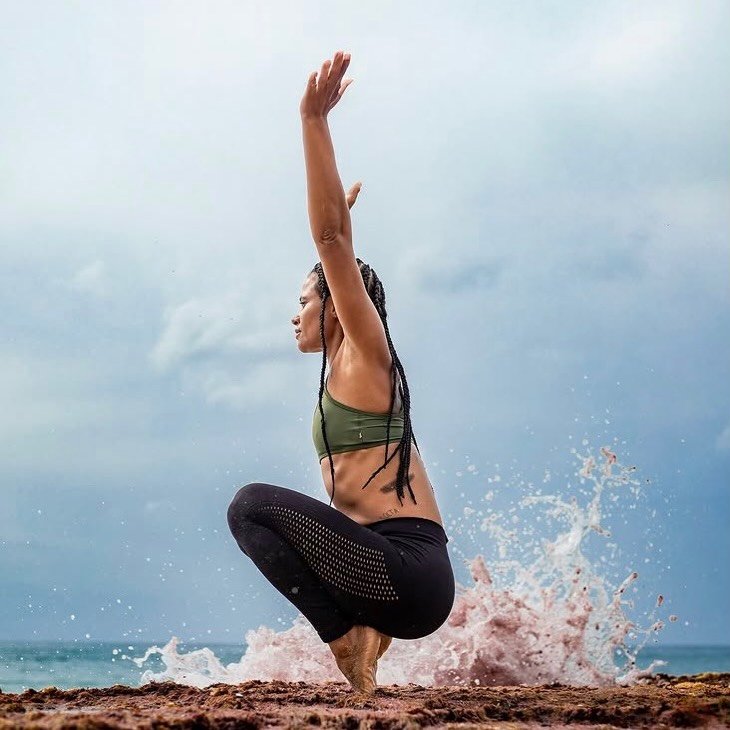 Yoga teacher at a Buoyant beach yoga event in Salvador, Brazil