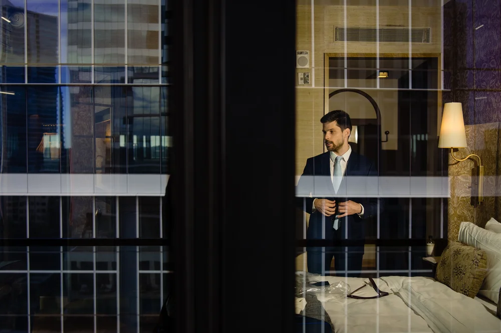groom-portrait-austin-proper-hotel-window-view