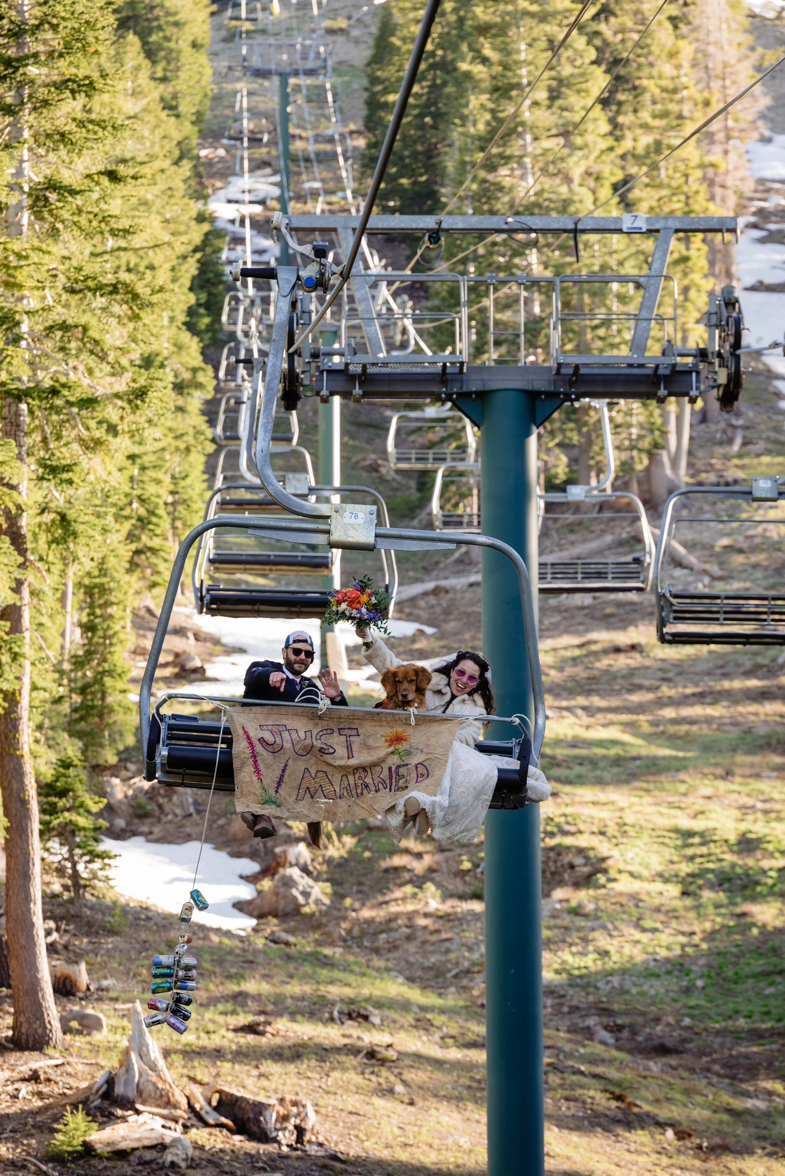  Just married couple on ski lift captured by incredible adventure wedding photographer 