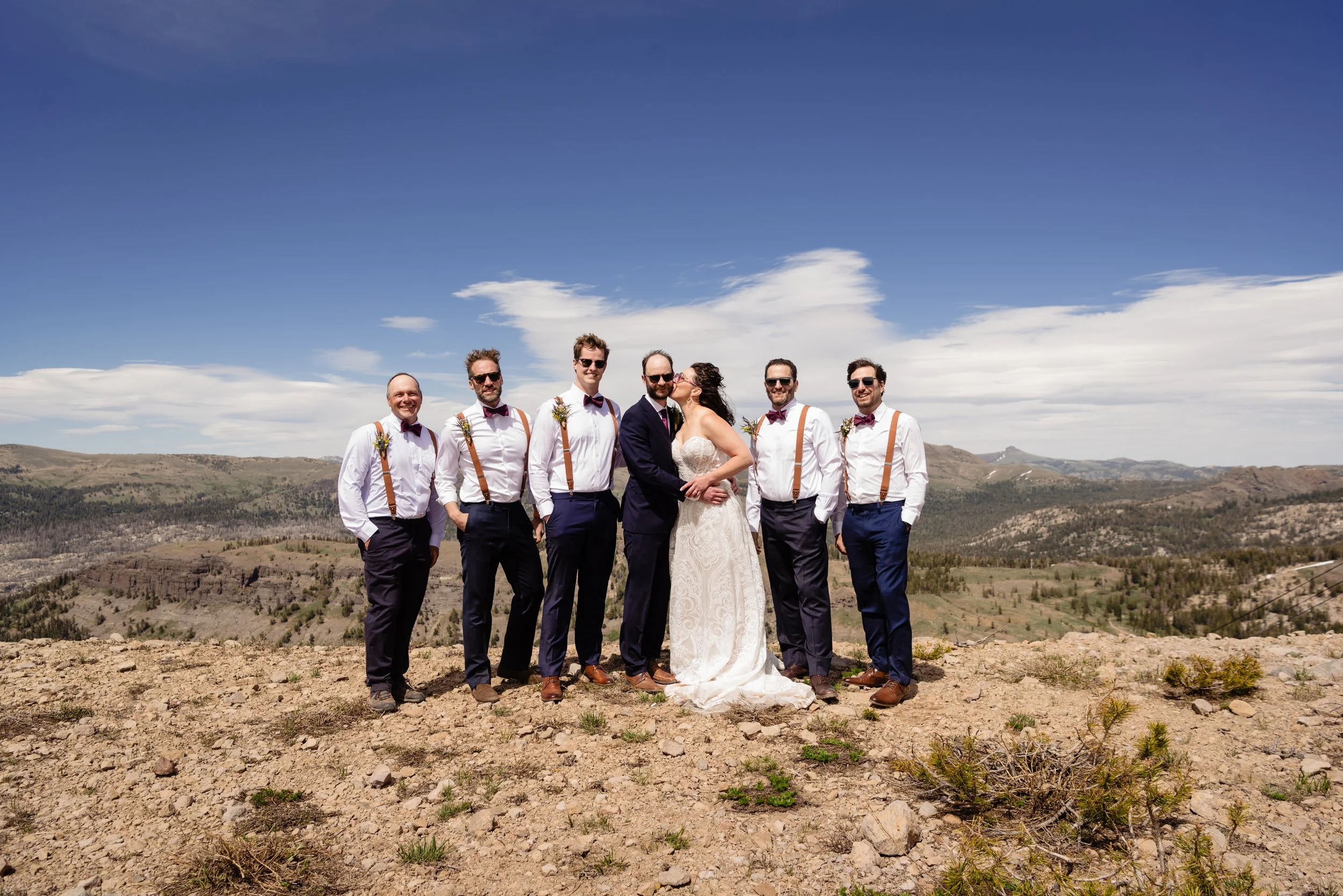 Bride and groomsmen on mountain 