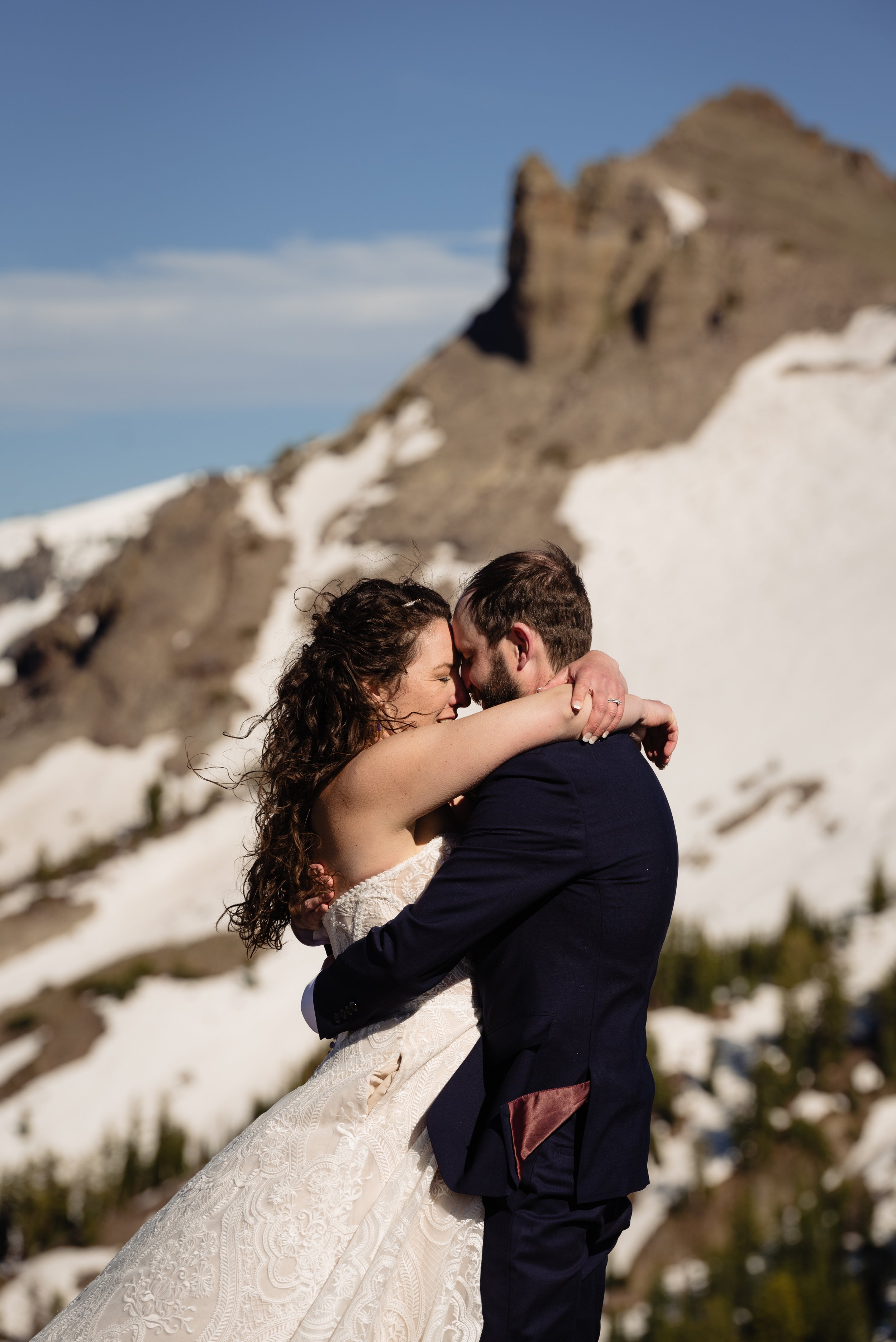  Couple embracing on mountain 