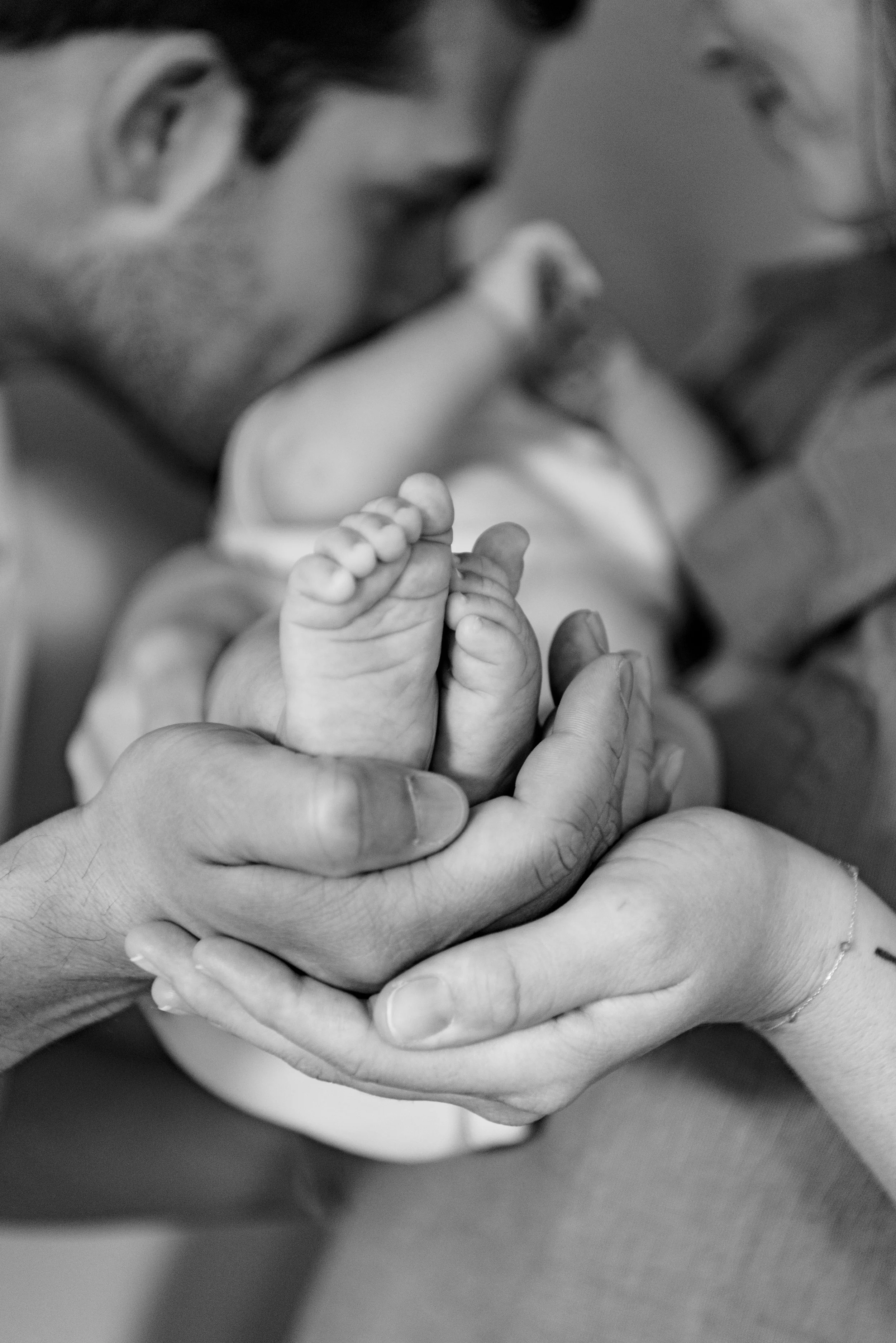 Black and white detailed photo of new family taken by lifestyle photographer in Austin
