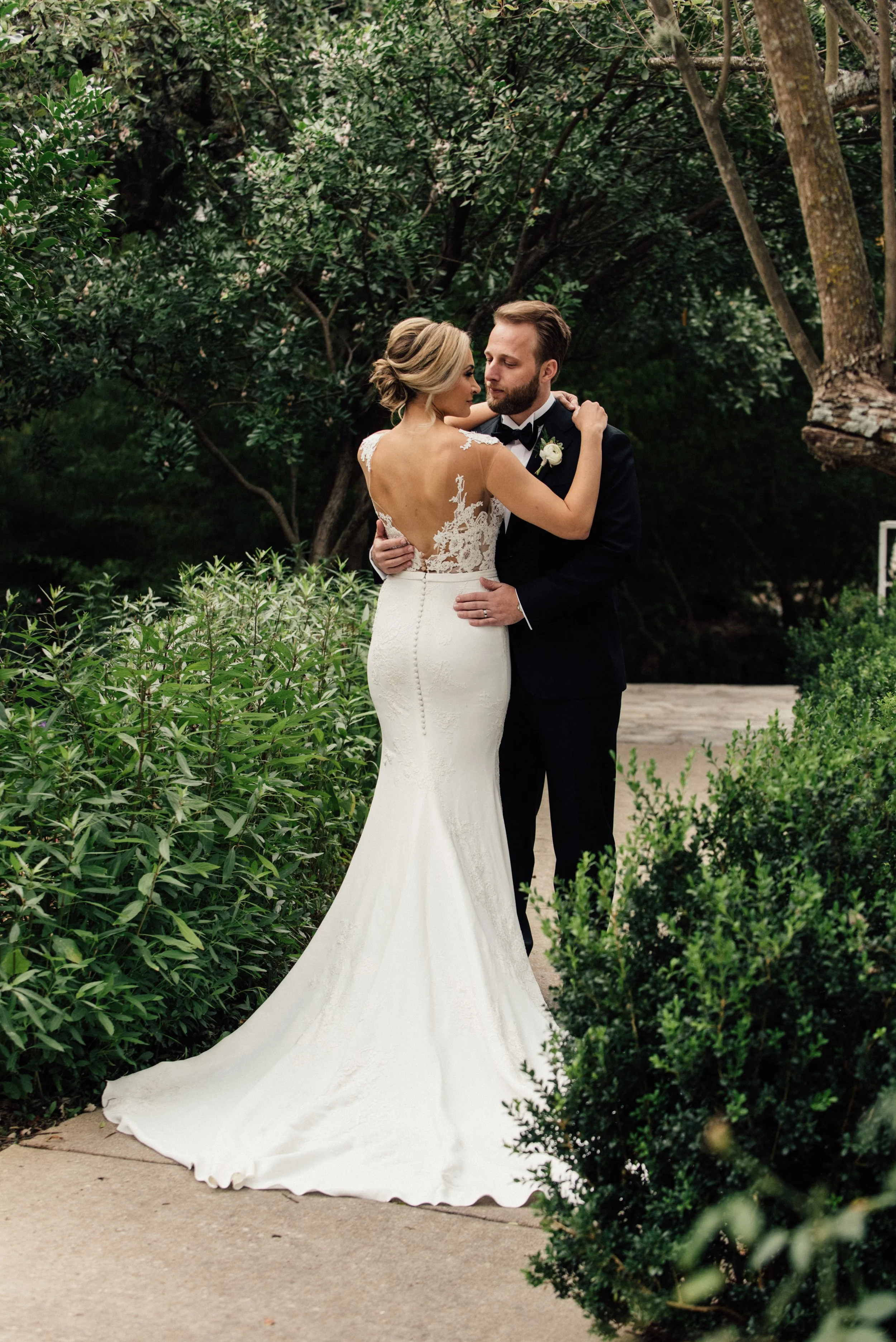 newlyweds posing outside