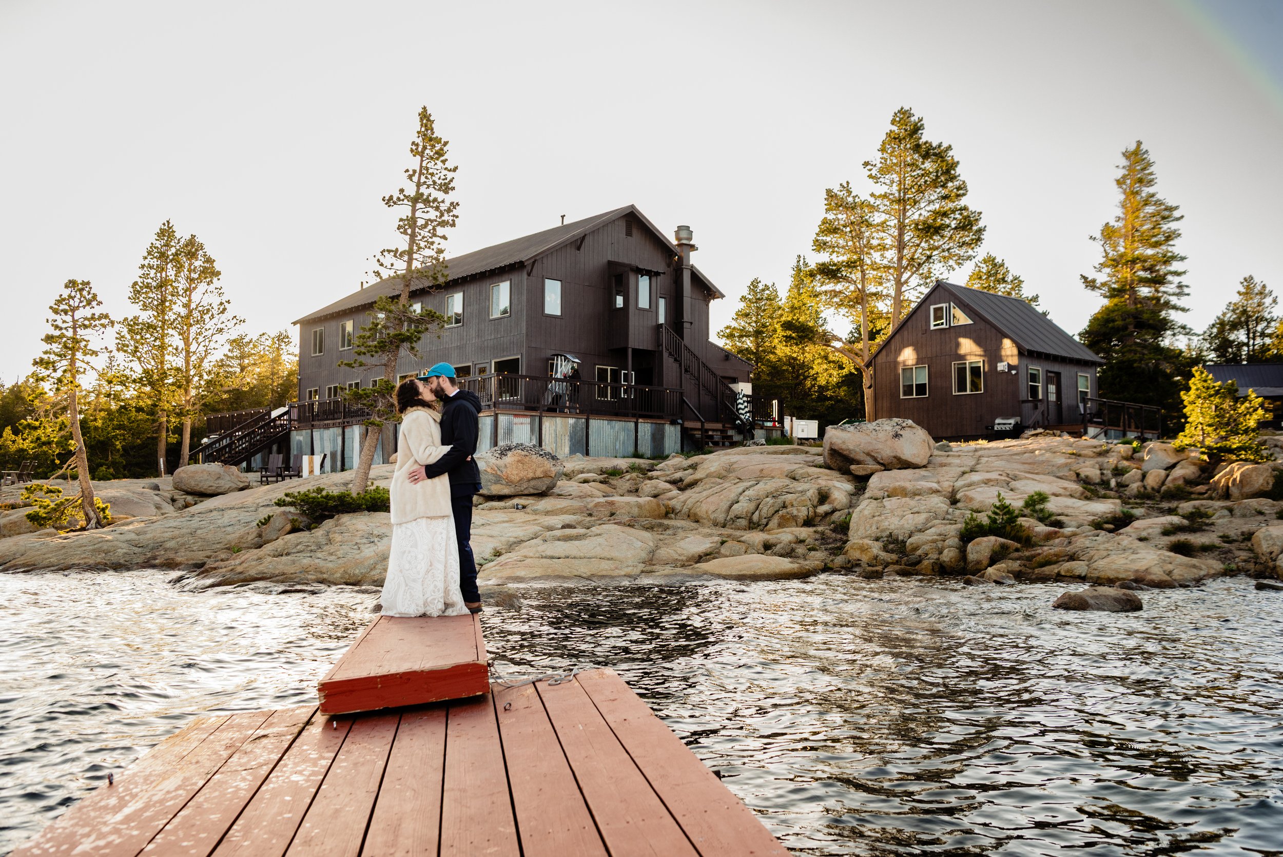 Newlyweds kissing at golden hour with their adventure wedding photographer