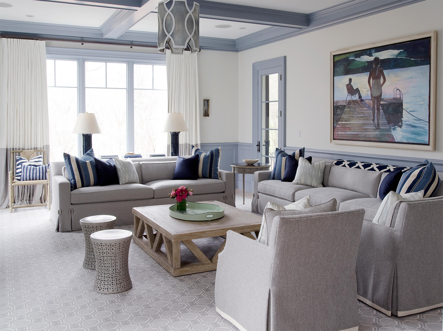 Living room in grays, blues and white.