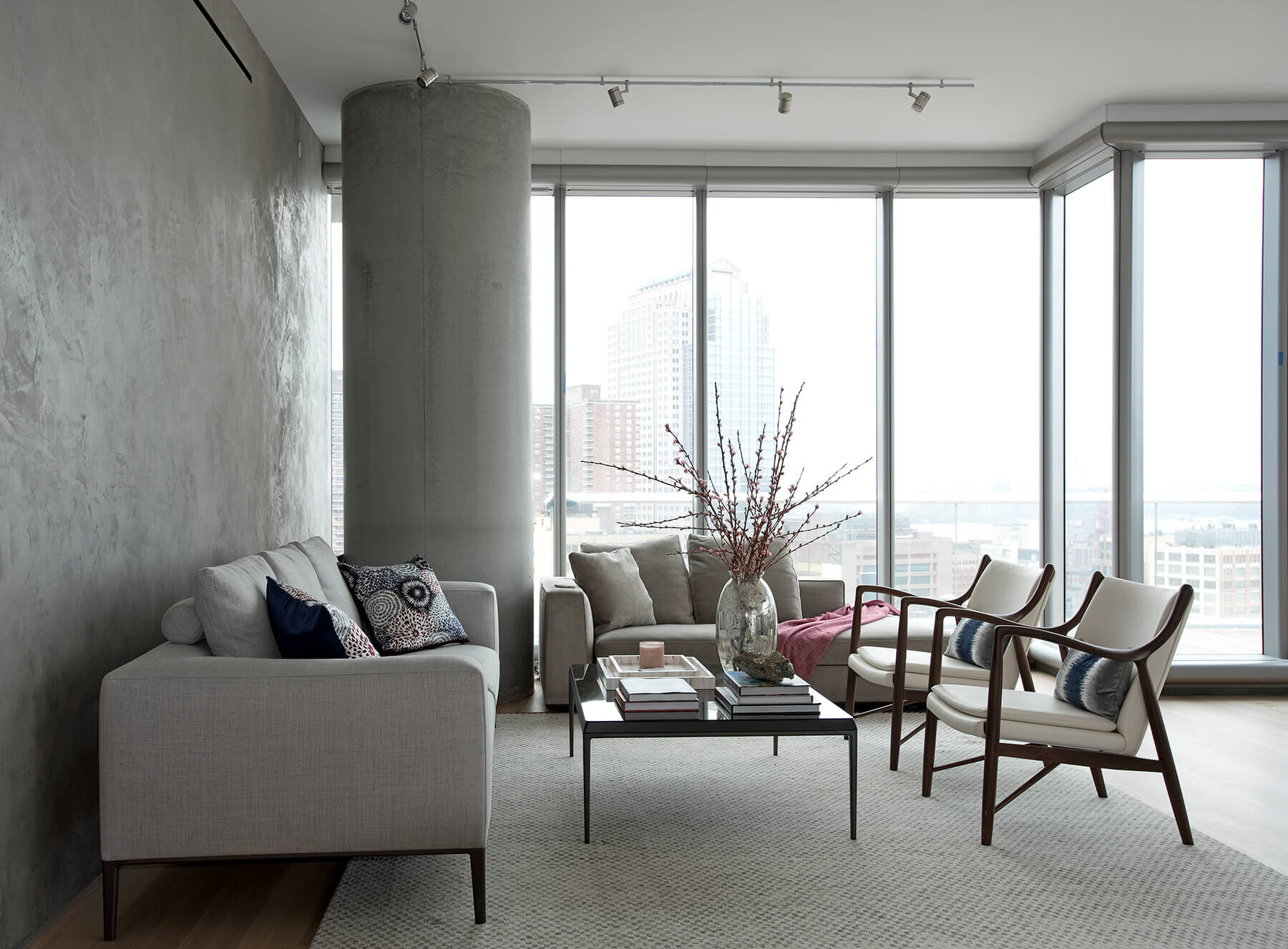Modern concrete and glass living room in New York City.