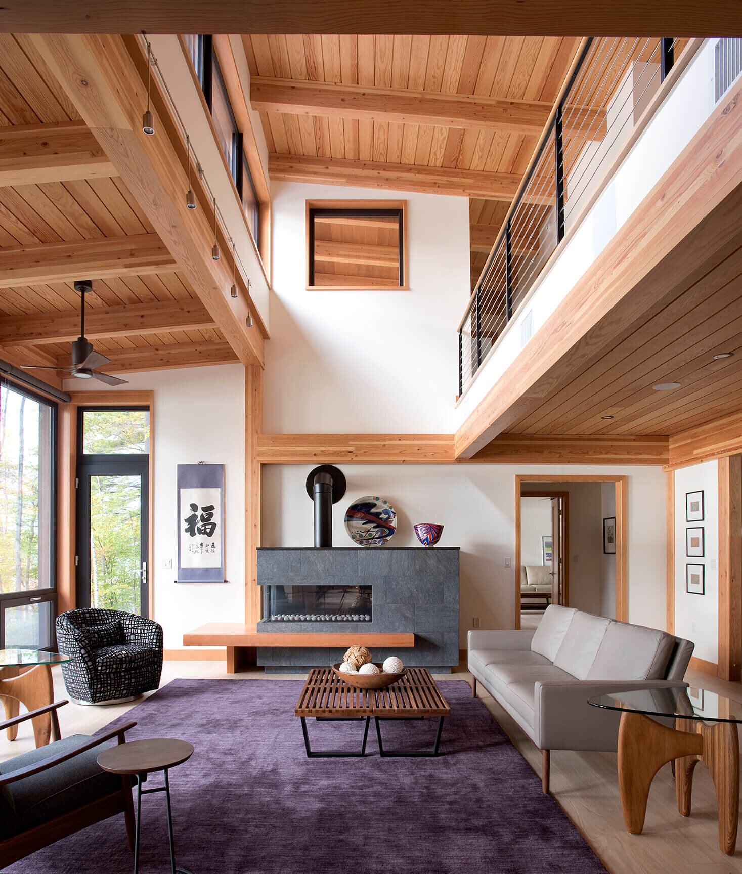 Modern timber frame living room with wood stove.