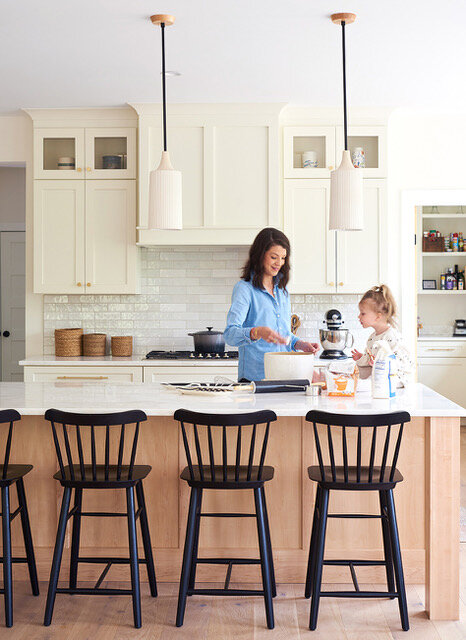 Transitional kitchen with mom and daughter baking.