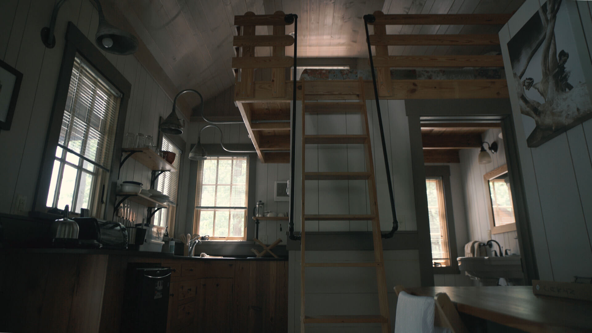  The kitchen and loft are connected together with a space-saving ladder.  