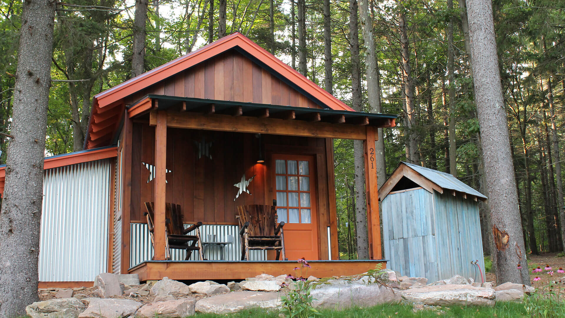  Front porch and outdoor shower for this tiny house are very important to help enjoy the outdoors. 