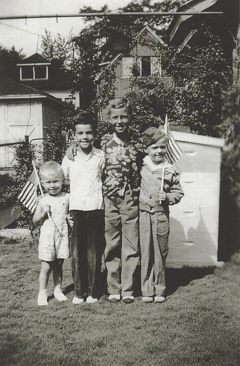 Left to right: Douglas Klauba; George Klauba; David Klauba; and James Martin, wearing his father's marine cap, 1945
