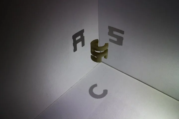"Gödel Escher Bach"-Inspired Shadow Cube.