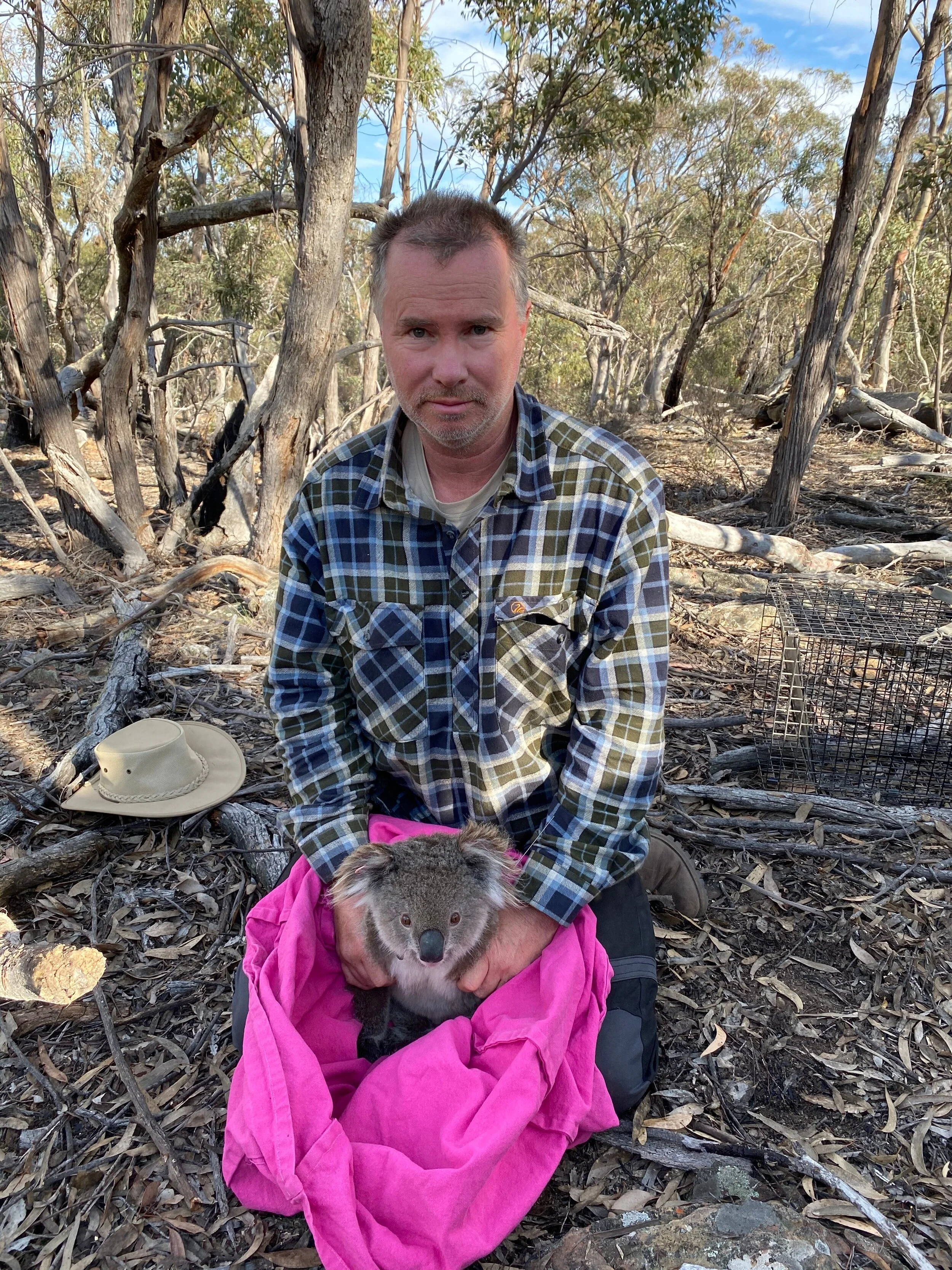James with a baby koala rescued after the bushfires. Image sourced from James Fitzgerald