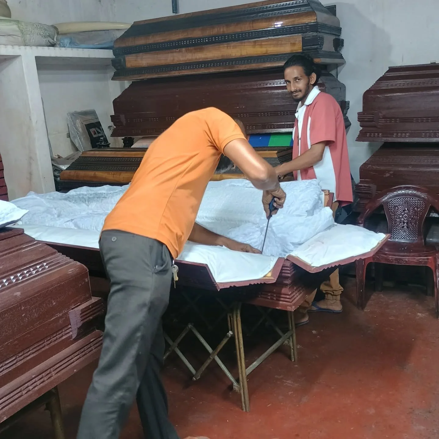 Yes I am on holiday, but I never stop thinking about our mortality and how we look after people. 
This coffin makers is around the corner from my home stay, and they generously allowed me in to chat and take photographs. 
There are many roadside buri