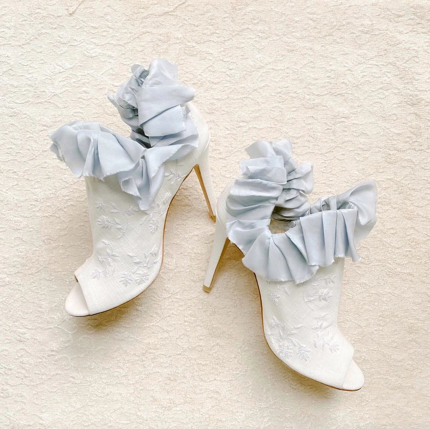 Inspired by Marie Antoinette, I pleated some gorgeous silk ribbon from @froufrouchic to add to my Peony #joyproctorforbellabelle bootie. The ruffles add a playful femininity to the embroidered shoe with floral detailing taken from my logo. iPhone ima