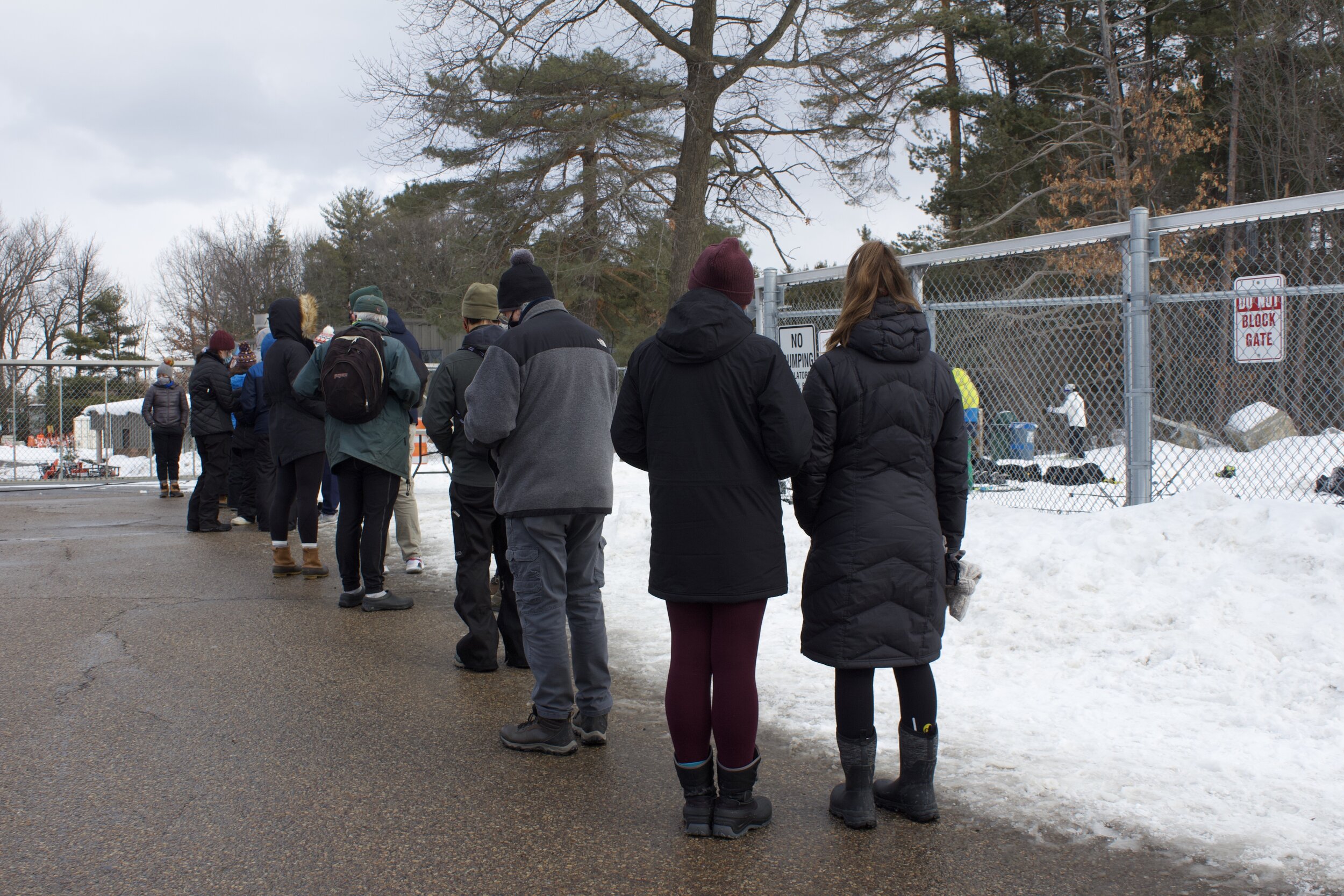   People wait patiently in line for their turn to ski.  