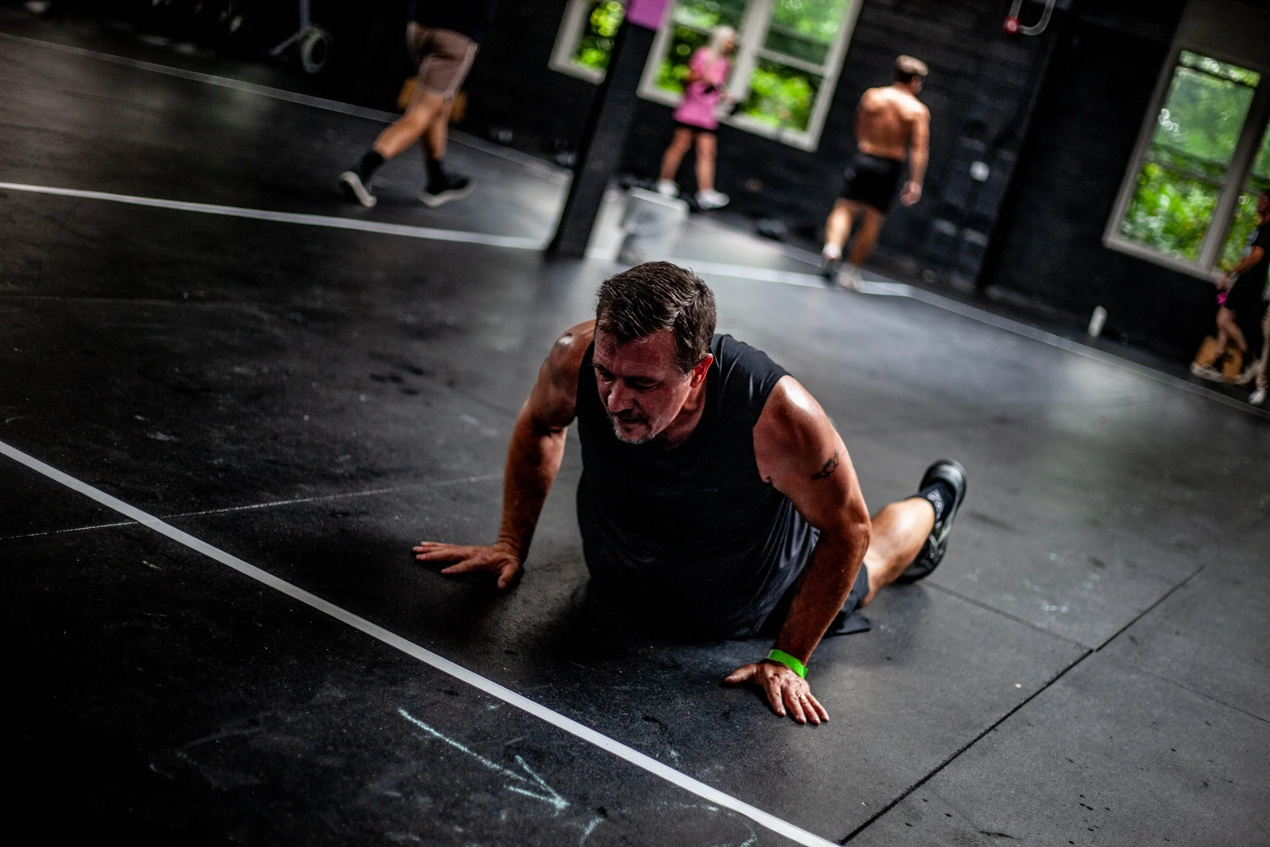 Man in a gym going a push up