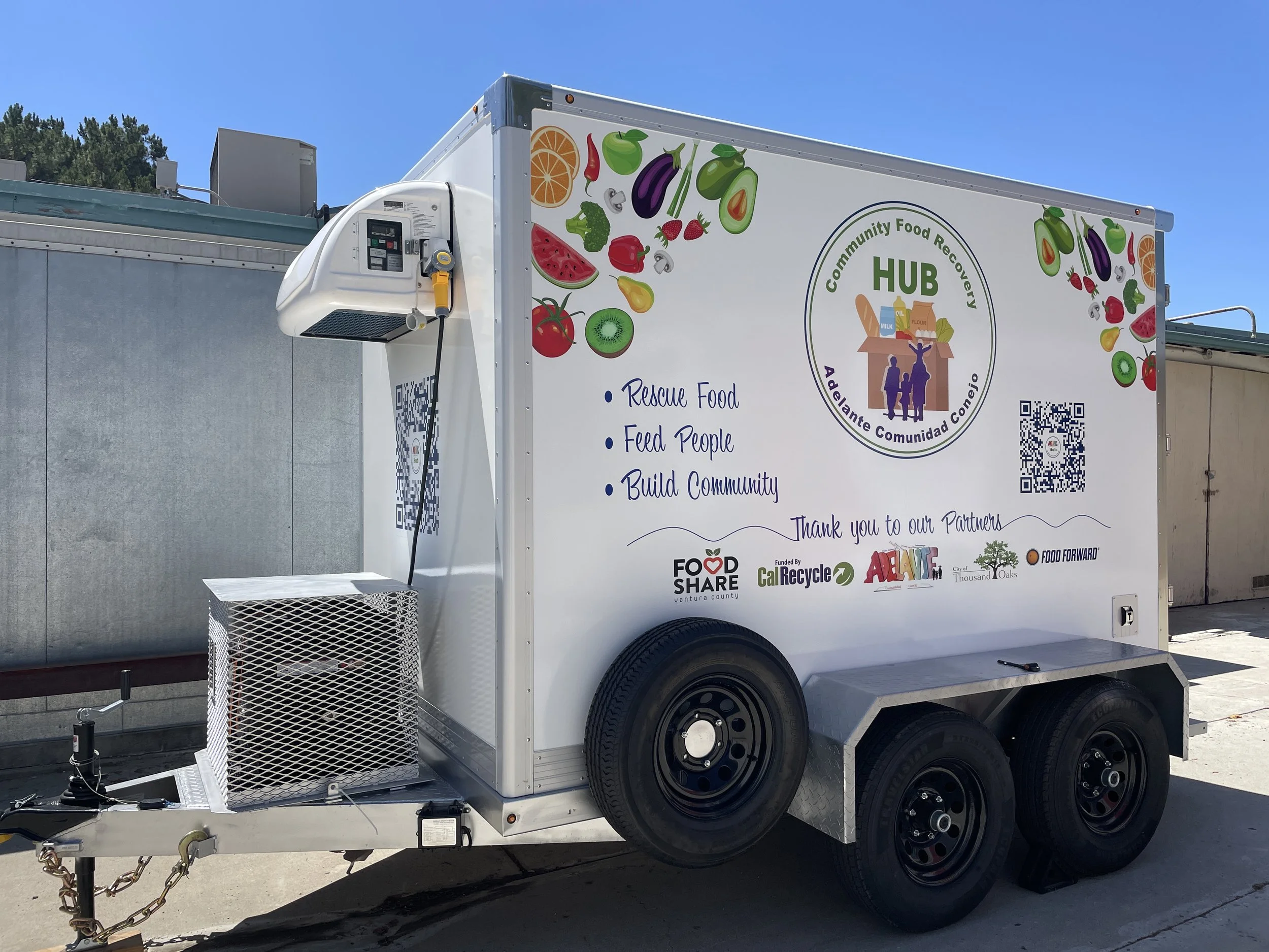 side view of cooler trailer with Hub logo