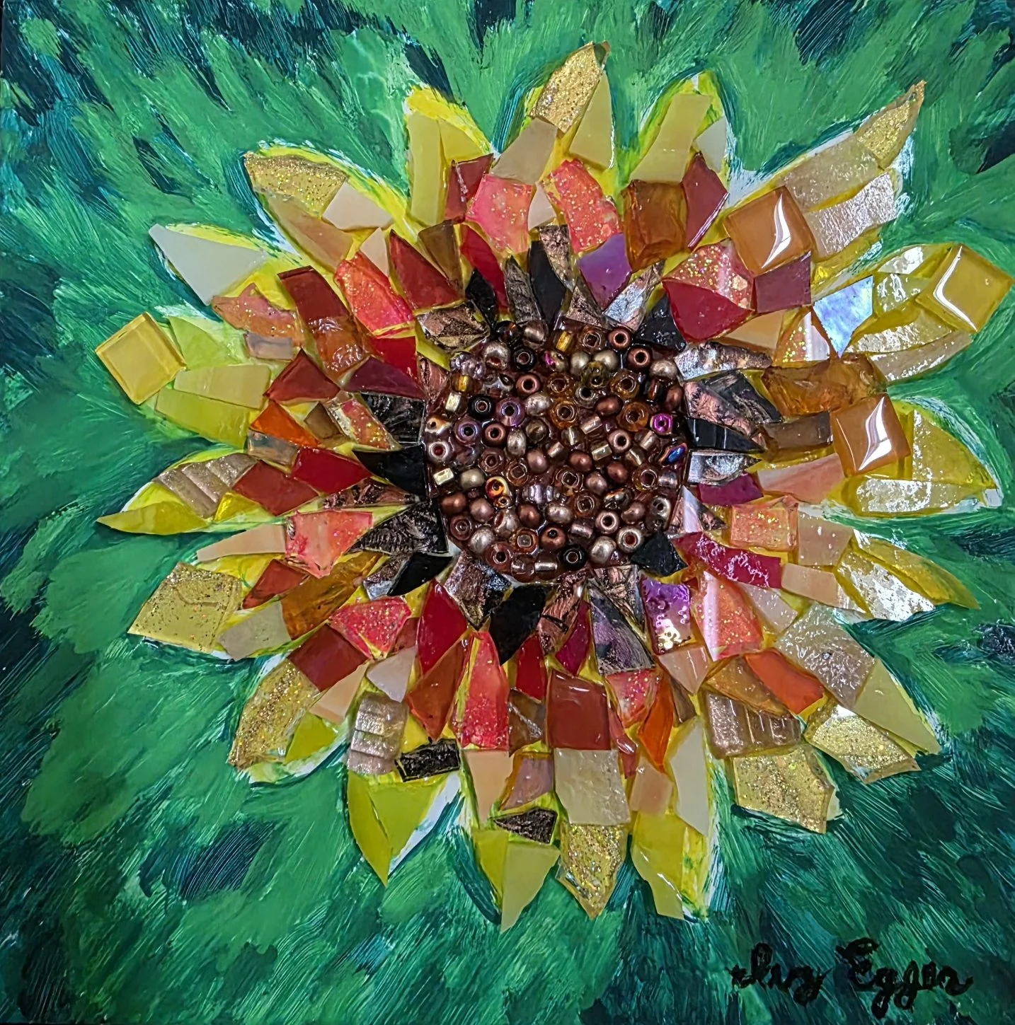 Artwork: yellow, orange, brown sunflower mosaic on green background