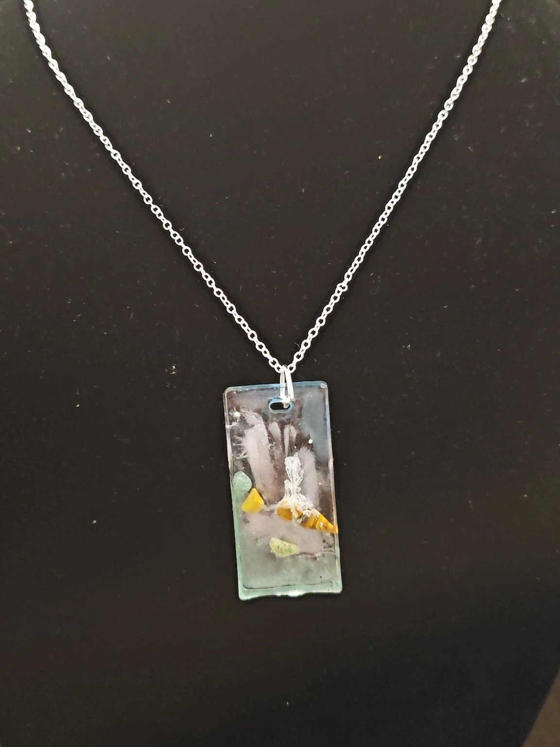 Waterfall pendant on black jewelry stand