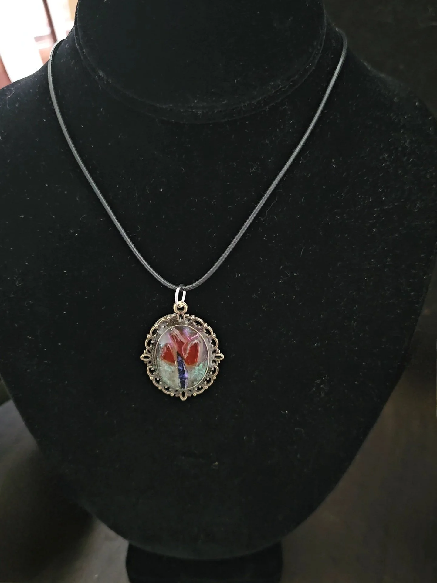 rose mosaic pendant on a cord necklace