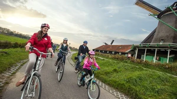 Family learning from a local guide on a cultural sightseeing tour
