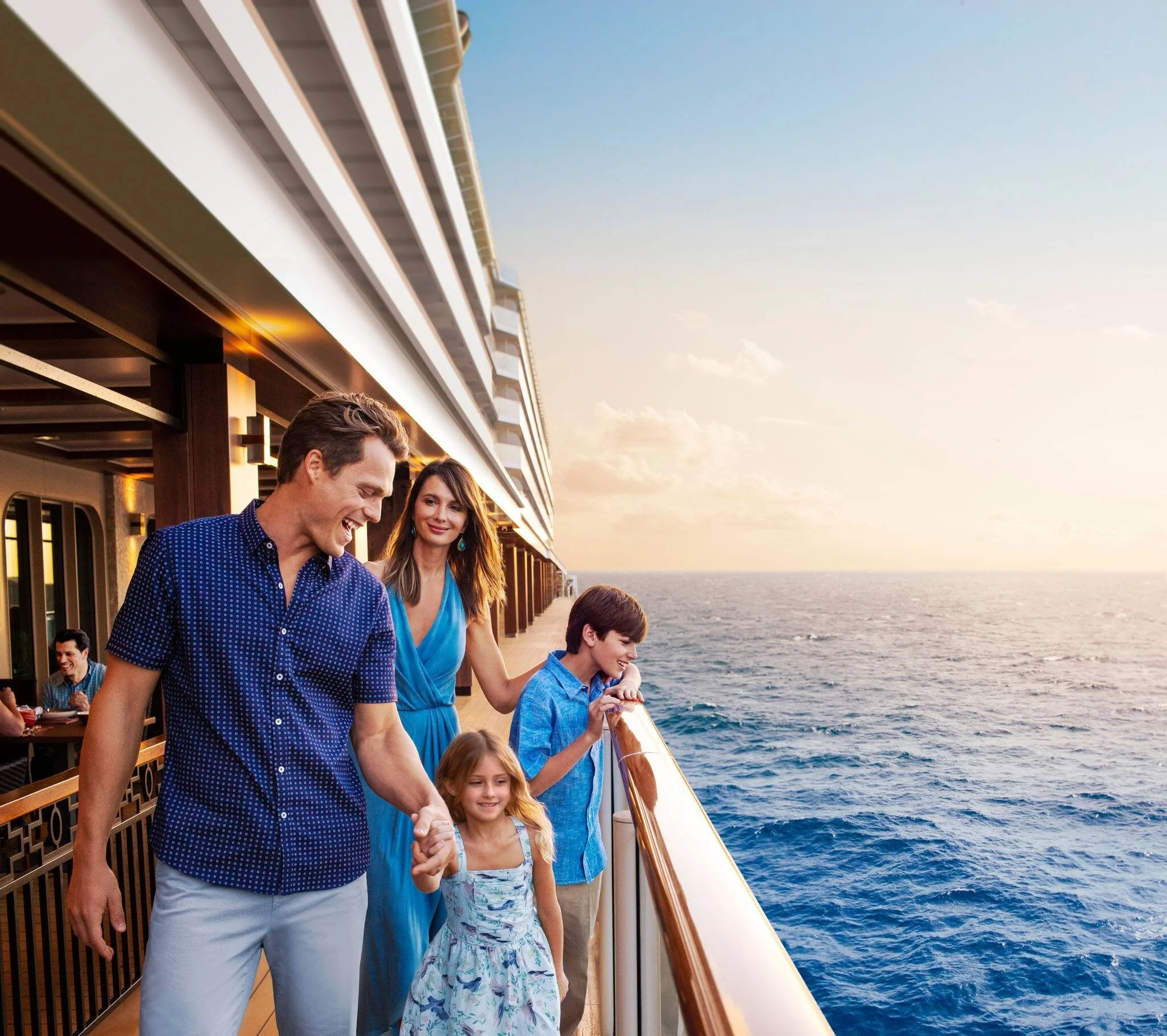 Family relaxing together on a cruise ship deck with ocean views