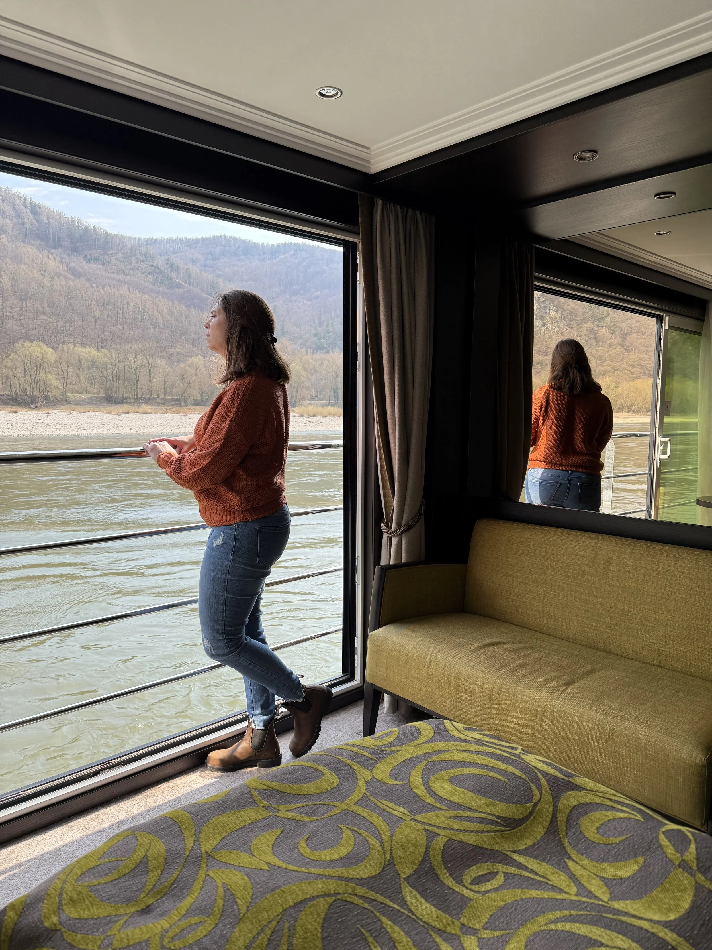 Travel advisor, Tara McCoy, in panorama suite river cruise cabin.