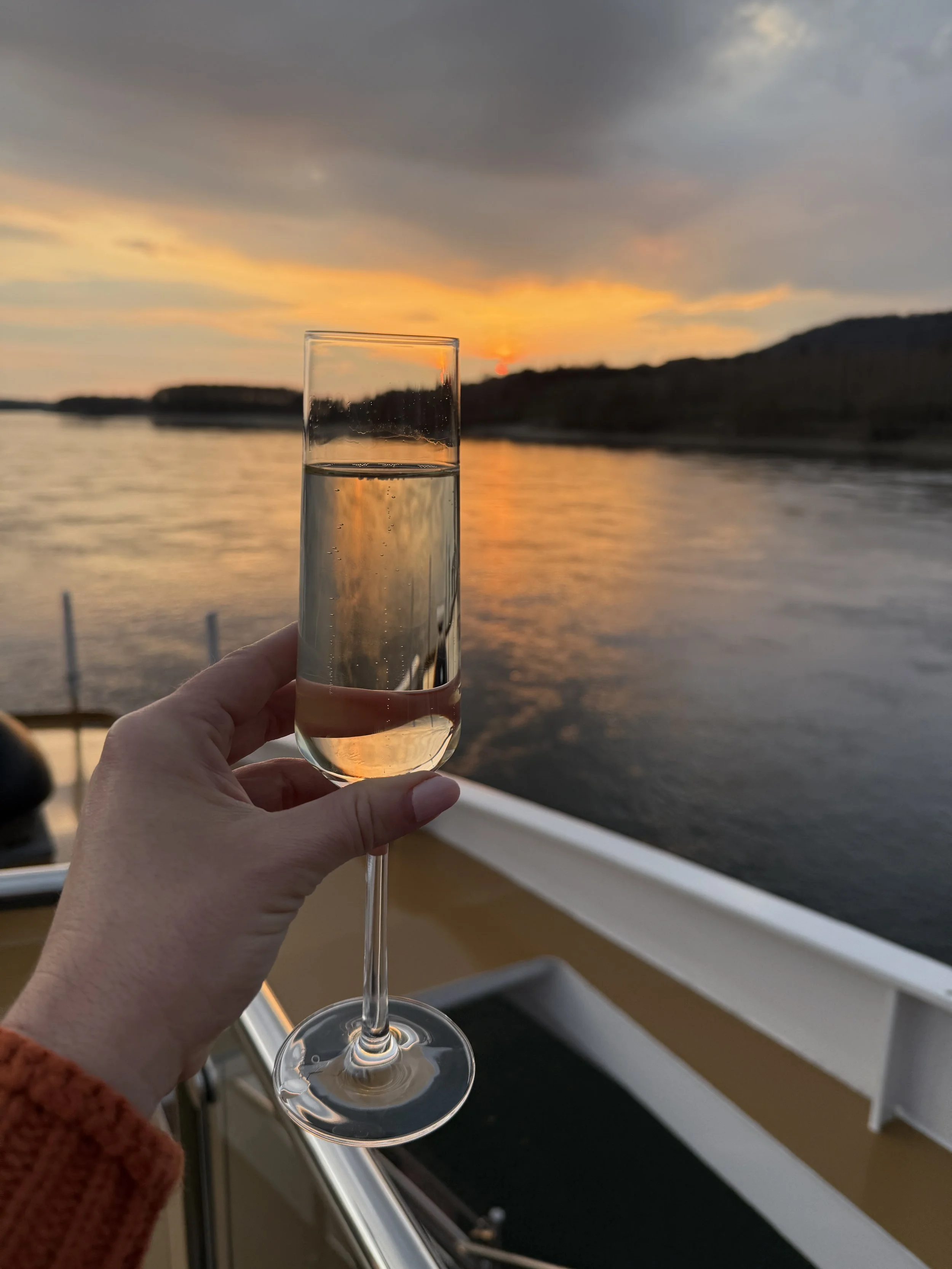 Champagne at sunset onboard European river cruise.
