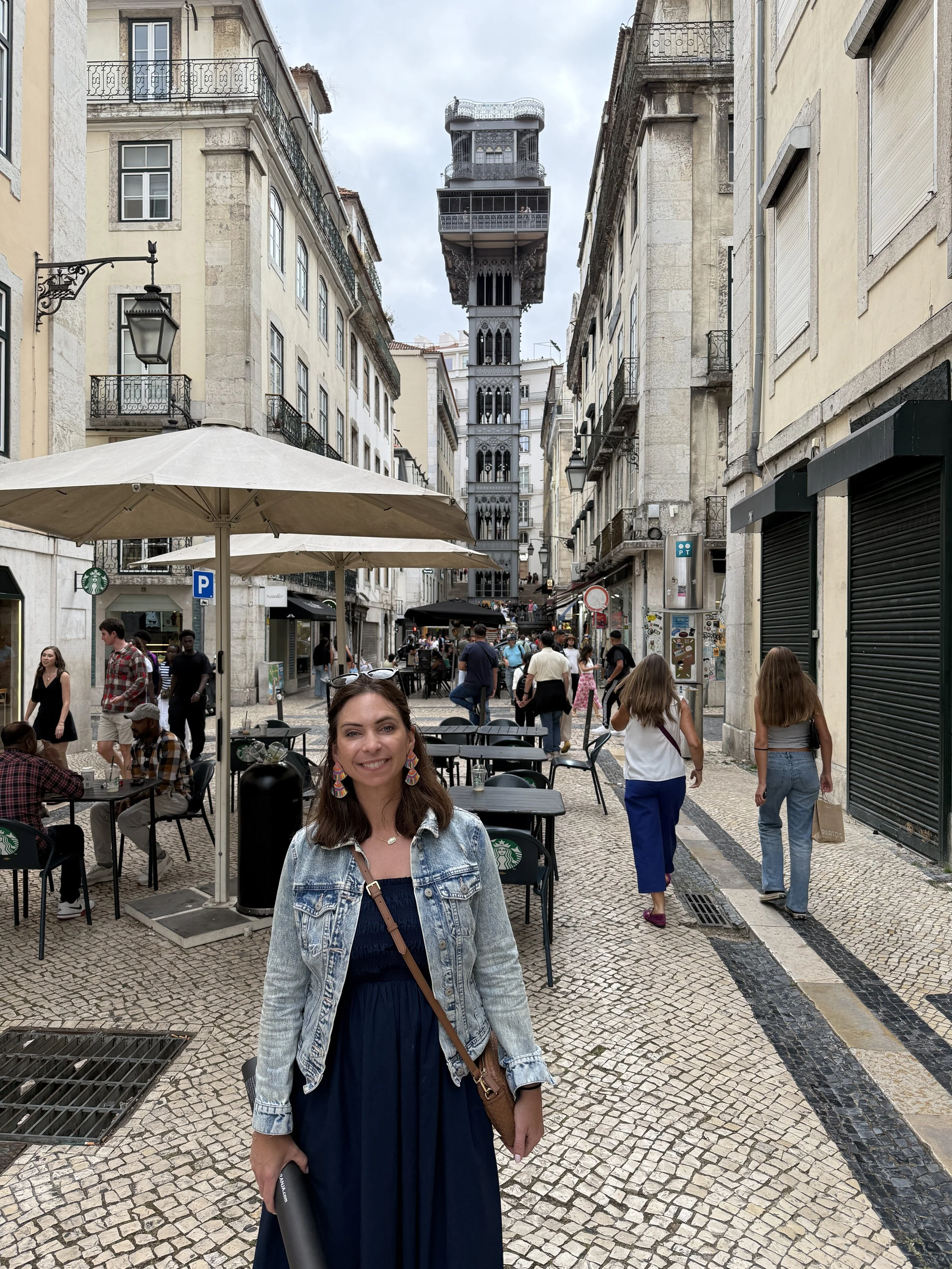 Woman wandering through the streets of Baixa and Chiado in Lisbon, Portugal